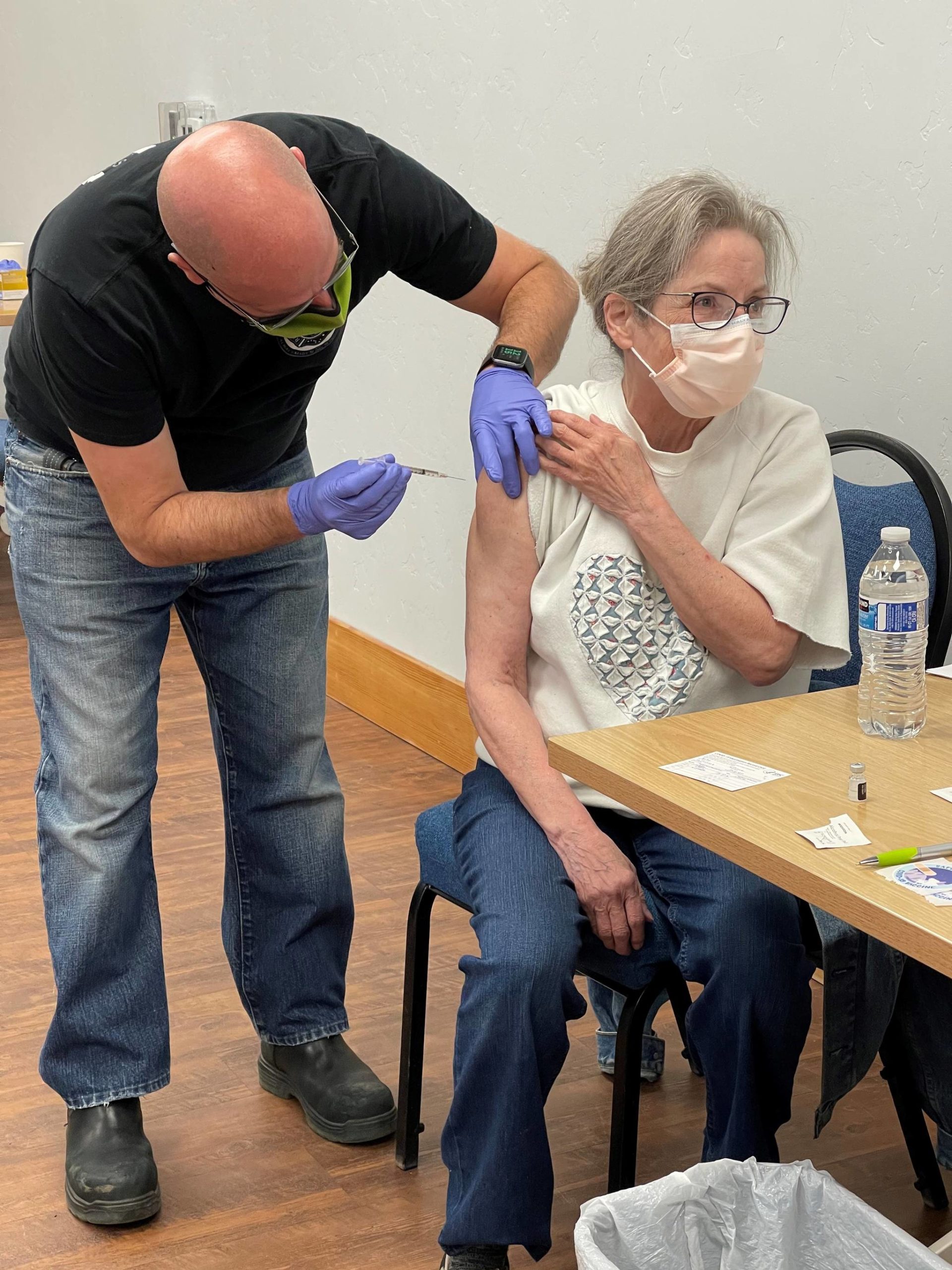 EMT Jason Tauriainen administers a COVID-19 vaccine on Saturday, Jan. 23 in Nikiski, Alaska. (Photo courtesy of the Nikiski Senior Center)