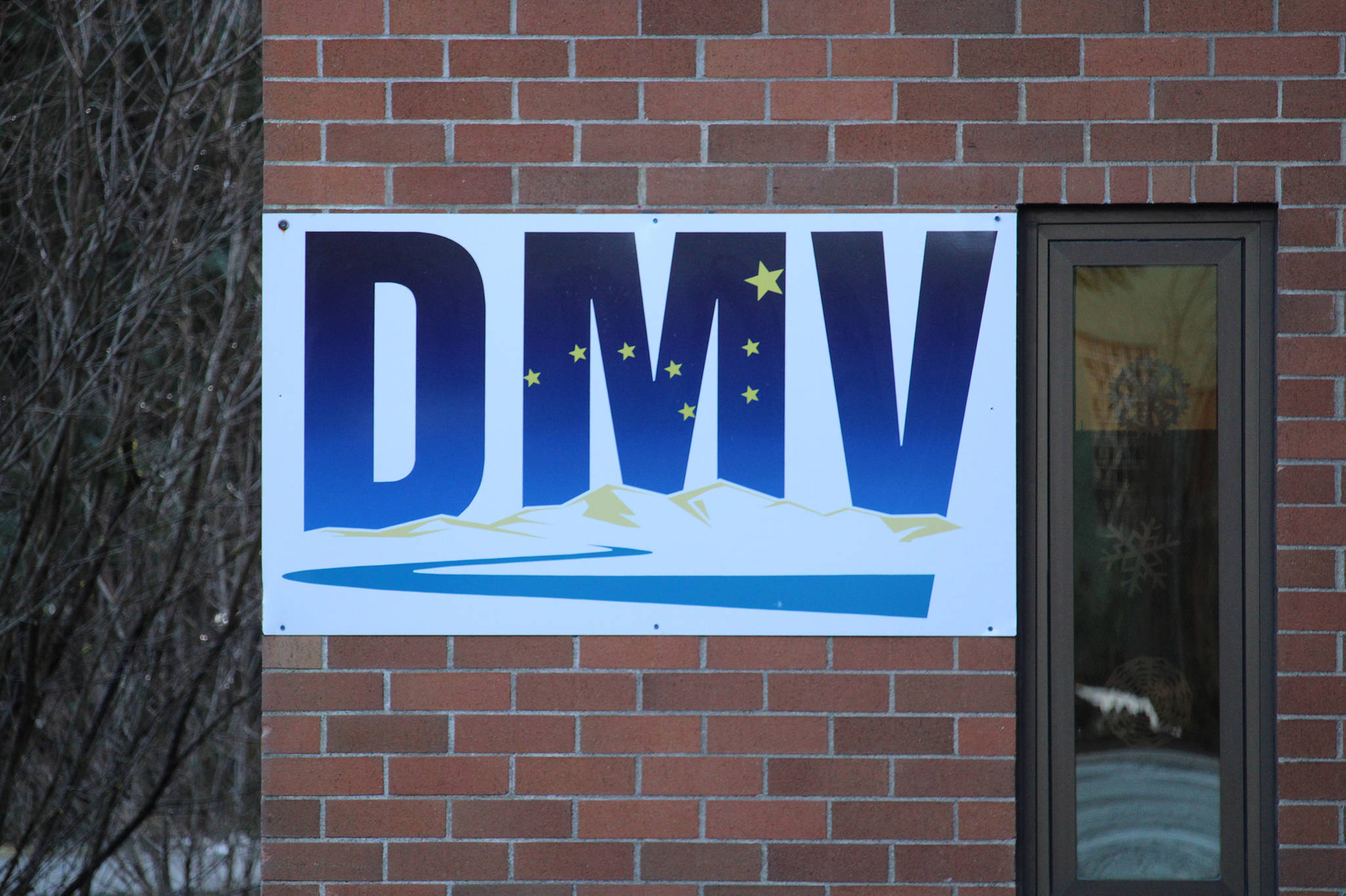 This photo shows a sign marking the Division of Motor Vehicles office in the Mendenhall Valley area of Juneau. Department of Administration Commissioner Kelly Tshibaka announced Monday that she was ordering a review of Division of Motor Vehicles’ processes to determine how plates reading “3REICH” were issued. (Ben Hohenstatt / Juneau Empire File)