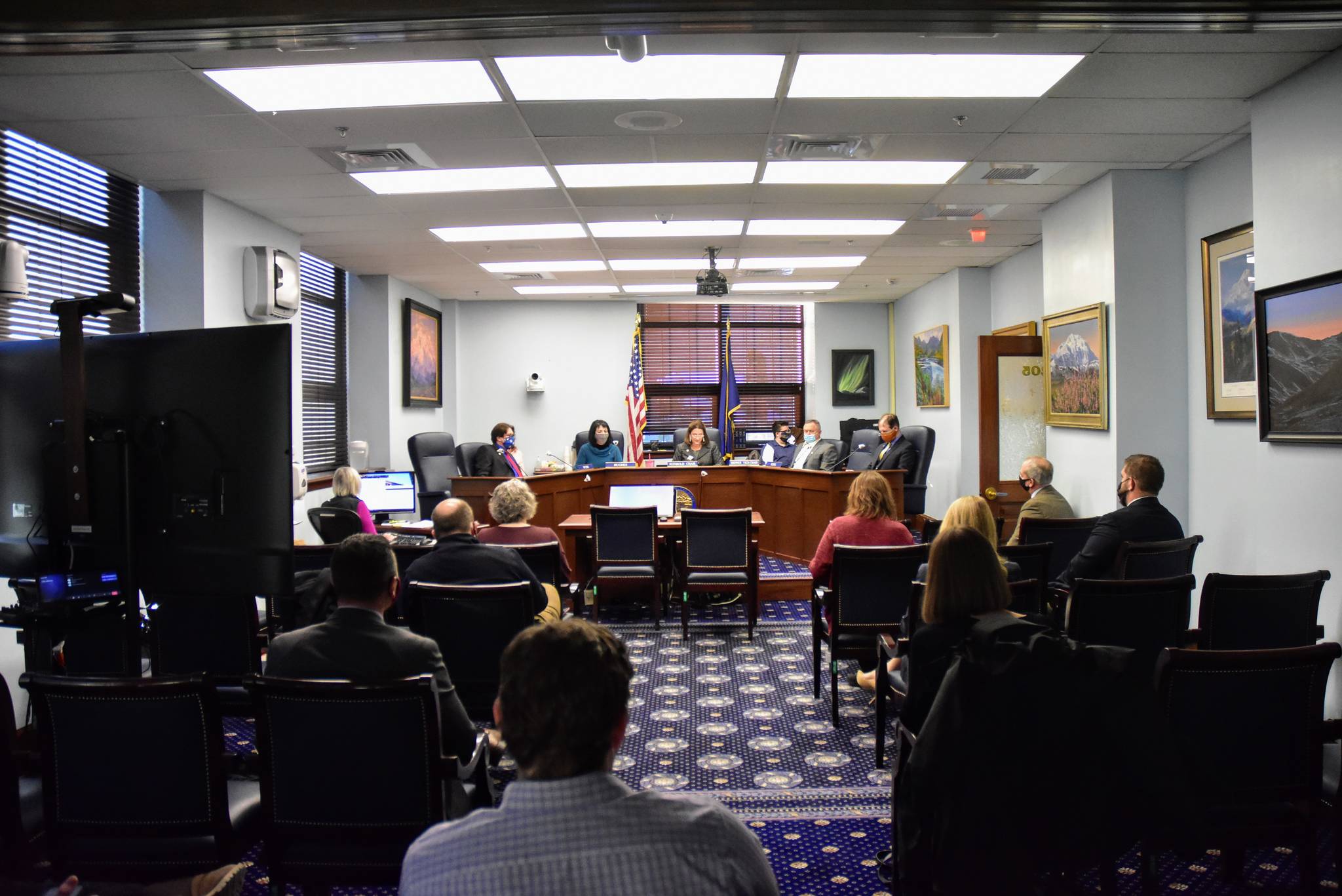 Staff, lawmakers and members of the press gather for the first Senate Judiciary Committee meeting of the 32nd Legislature on Wednesday, Jan. 27, 2021. While Senators moved ahead with work, the House of Representatives was once again unable to organize. (Peter Segall /  Juneau Empire)