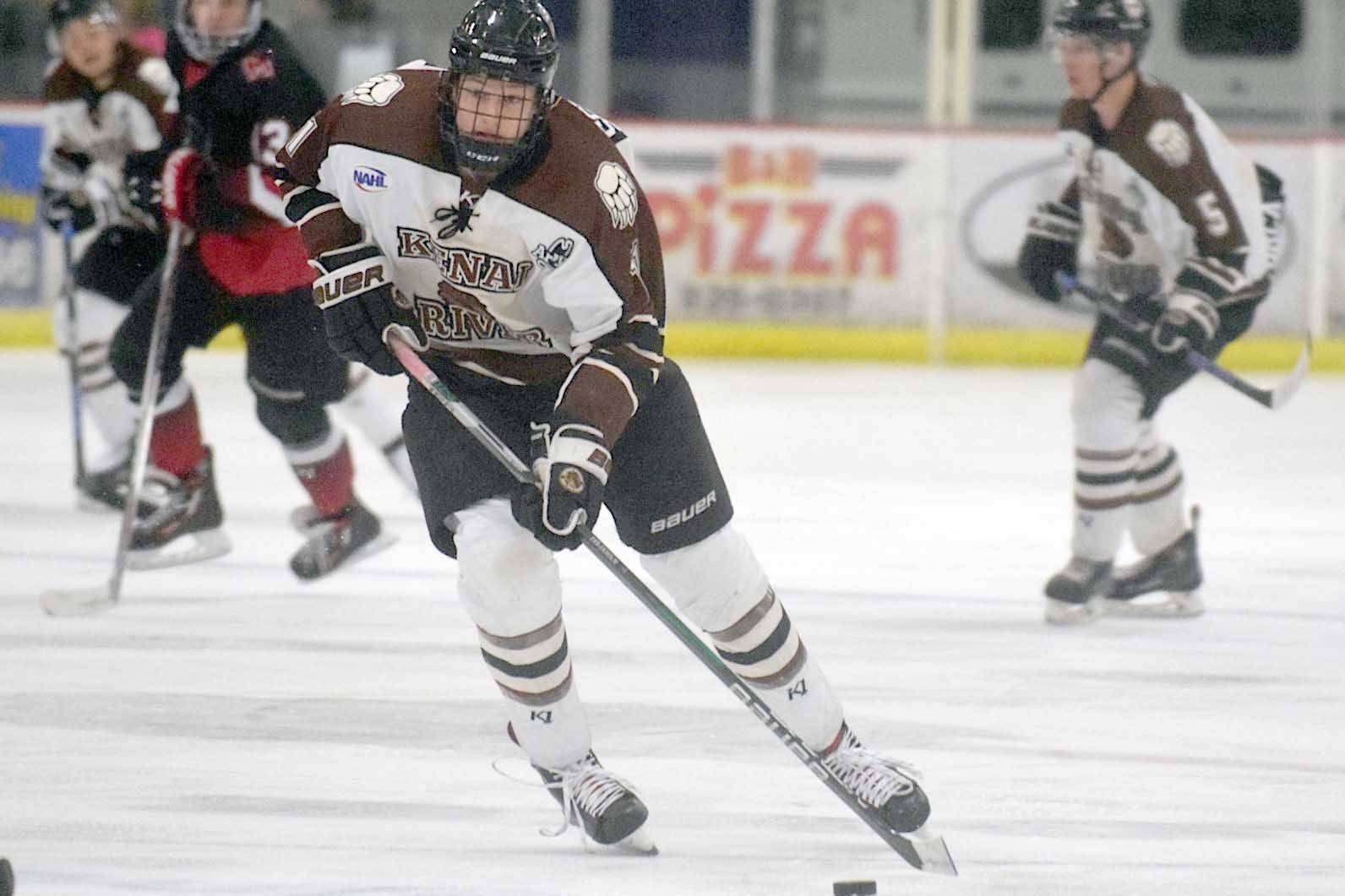 Kenai River Brown Bears forward Porter Schachle brings the puck up the ice Friday, Nov. 9, 2018, against the Minnesota Magicians at the Soldotna Regional Sports Complex. (Photo by Jeff Helminiak/Peninsula Clarion)