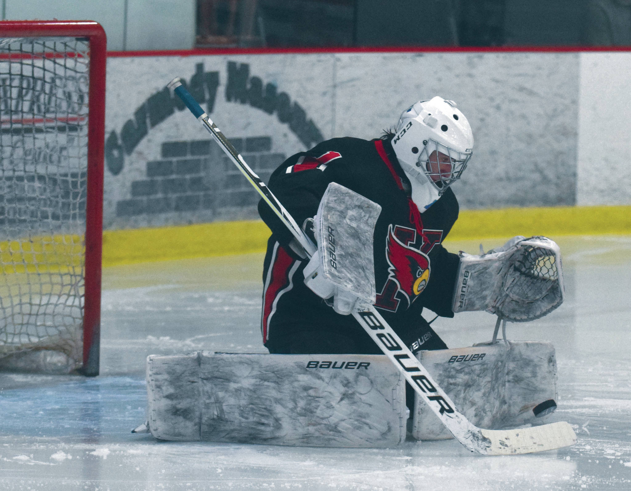 Kenai Central goalie Tommy Baker makes a save against Soldotna on Tuesday, Jan. 29, 2021, at the Soldotna Regional Sports Complex in Soldotna, Alaska. (Photo by Jeff Helminiak/Peninsula Clarion)