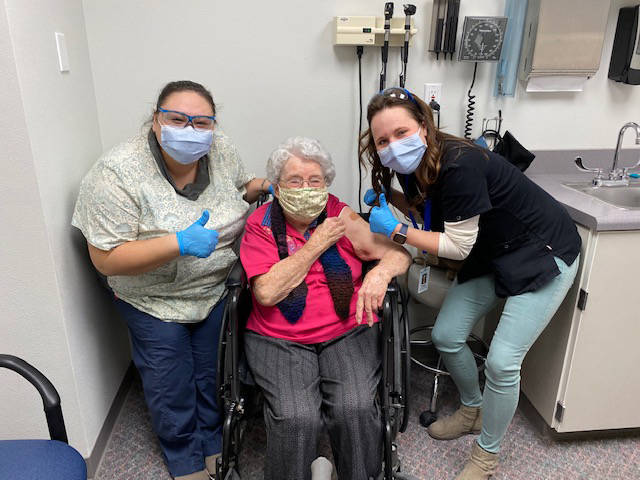 Nurses Jessie Arthur, left, and Denise Haviland, right, pose for a photo with Mildred Evenson, center, after giving her her first dose of the COVID-19 vaccine on Jan. 15, 2020. (Photo courtesy Kathleen Evenson)
