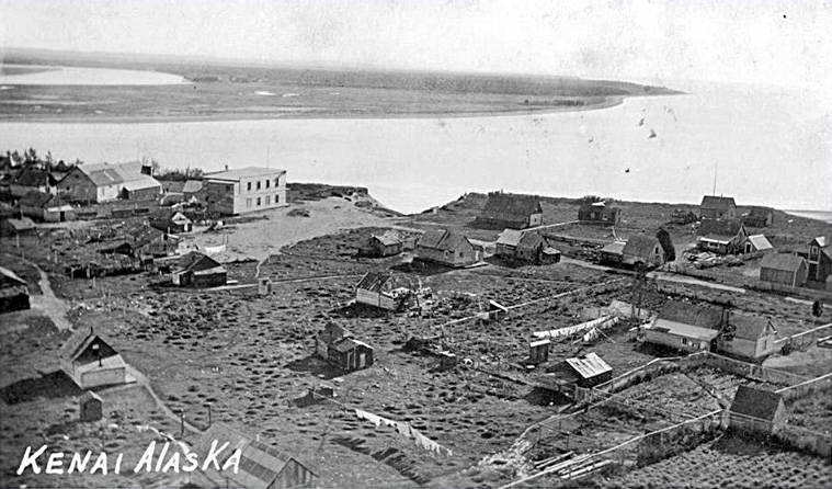Photo from the Kenai Historical Society 
This high-angle photo shows a portion of the village of Kenai atop the bluff above the mouth of the Kenai River in about 1919, a year after the double-killing.