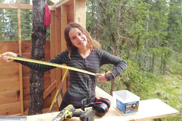 Rosalie Eller pauses construction work to pose for a photo in Ionia in the summer of 2020. (Photo courtesy Eliza Eller)