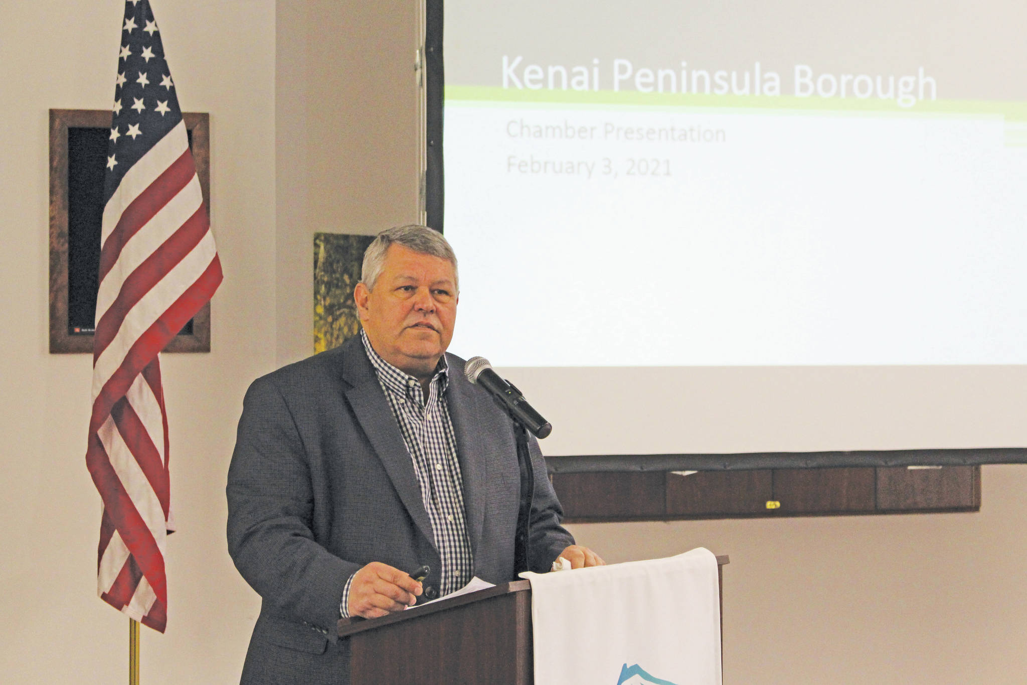 Brian Mazurek / Peninsula Clarion 
Kenai Peninsula Borough Mayor Charlie Pierce gives a presentation to members of the Kenai and Soldotna Chambers of Commerce at the Kenai Visitors and Cultural Center in Kenai on Wednesday.