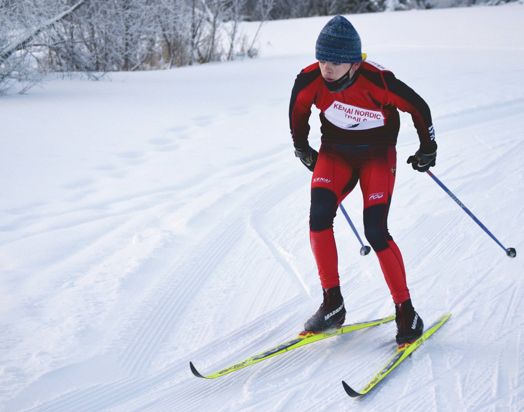 Kenai Central’s Gregory Fallon rounds a corner during Kenai Klassic at the Kenai Nordic Trails on Saturday, Feb. 6, 2021, in Kenai, Alaska. (Photo by Jeff Helminiak/Peninsula Clarion)