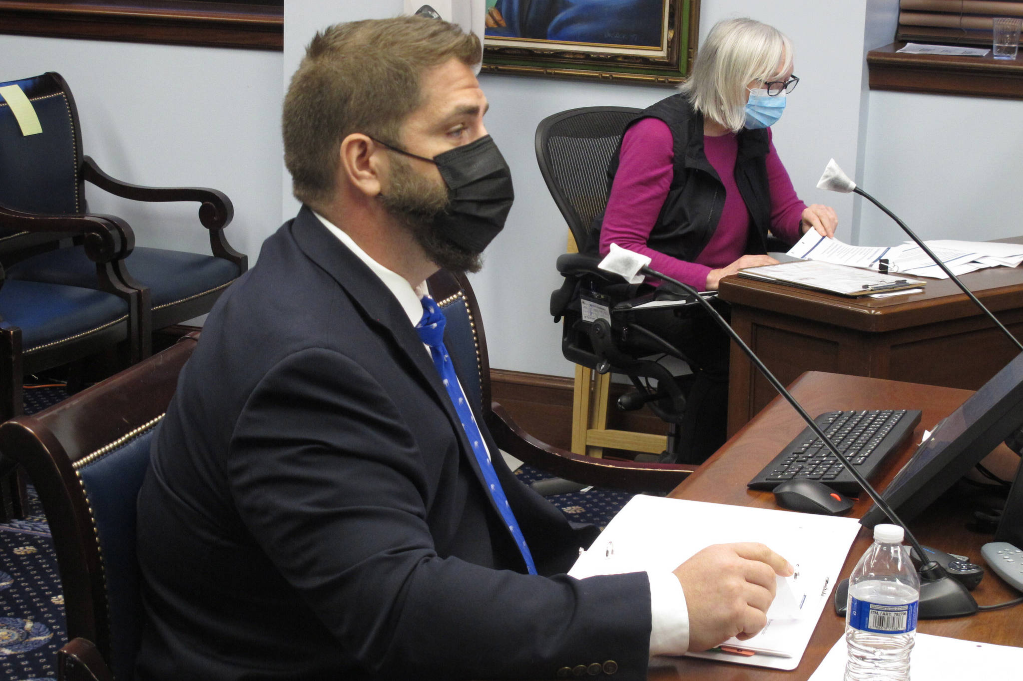 Adam Crum, commissioner of the Alaska state health department, testifies before a state Senate committee on Wednesday, Jan. 27, 2021, in Juneau, Alaska. Crum and other state officials have urged Alaska lawmakers to support Gov. Mike Dunleavy’s proposed extension of a disaster emergency related to COVID-19. (AP Photo/Becky Bohrer)