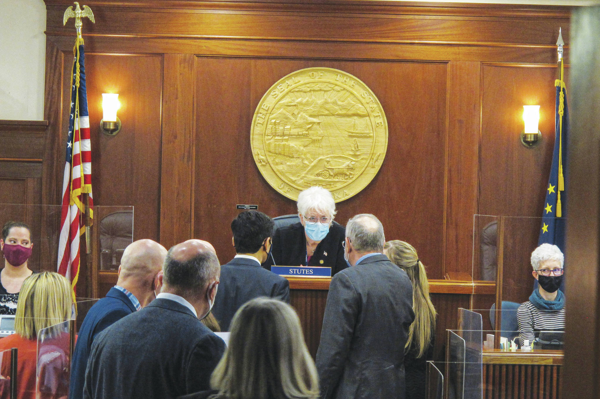 Alaska House Speaker Louise Stutes, center, sits before the start of a brief House floor session in Juneau, Alaska Thursday, Feb. 11, 2021. Rep. Stutes, a Kodiak Republican, was elected speaker on Thursday in a vote coming more than three weeks into the legislative session. (AP Photo/Becky Bohrer)