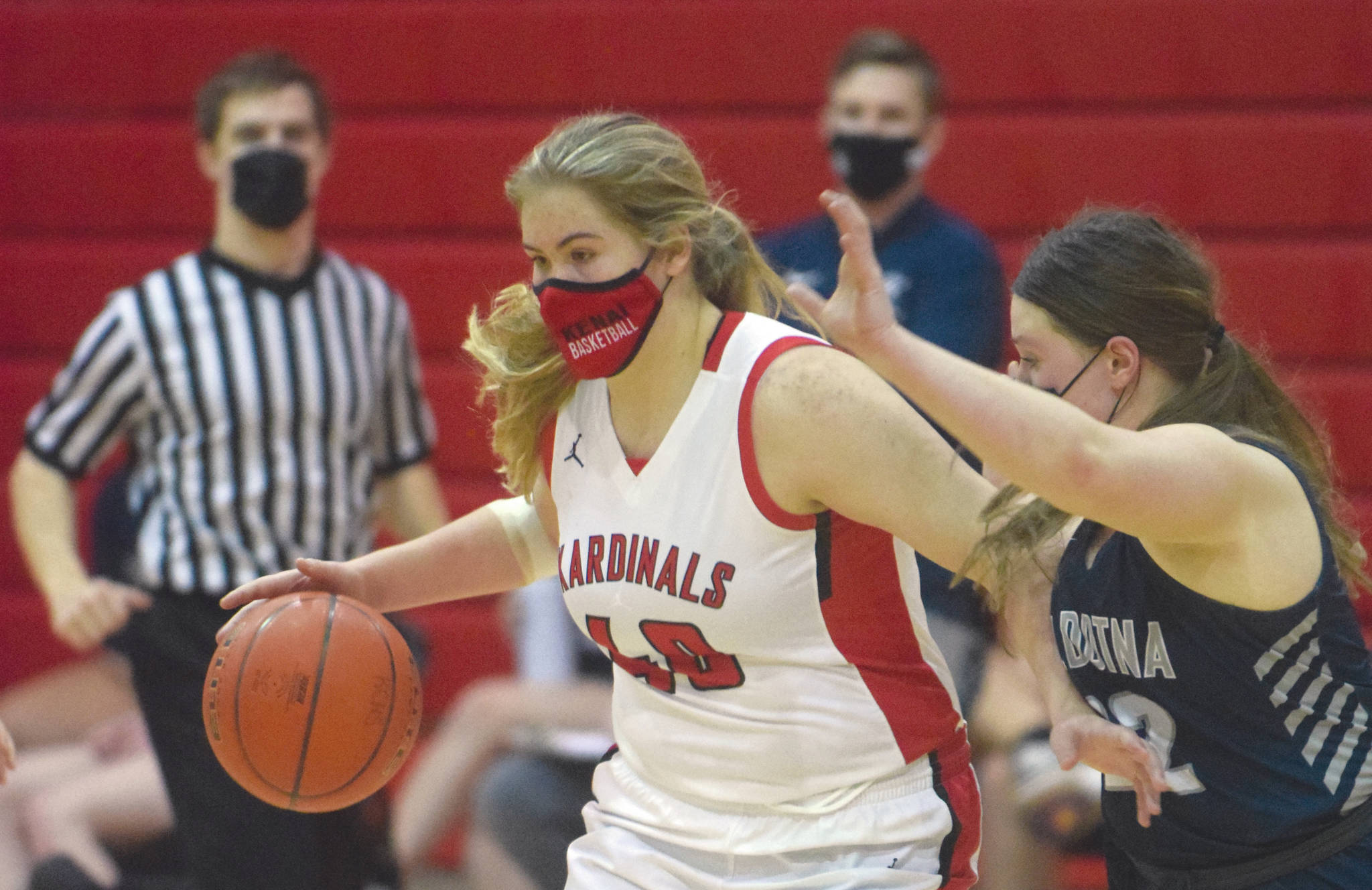 Kenai Centrals Emma Back brings the ball up the floor against Soldotnas Autumn Fischer on Thursday, Feb. 11, 2021, at Kenai Central High School in Kenai, Alaska. (Photo by Jeff Helminiak/Peninsula Clarion)