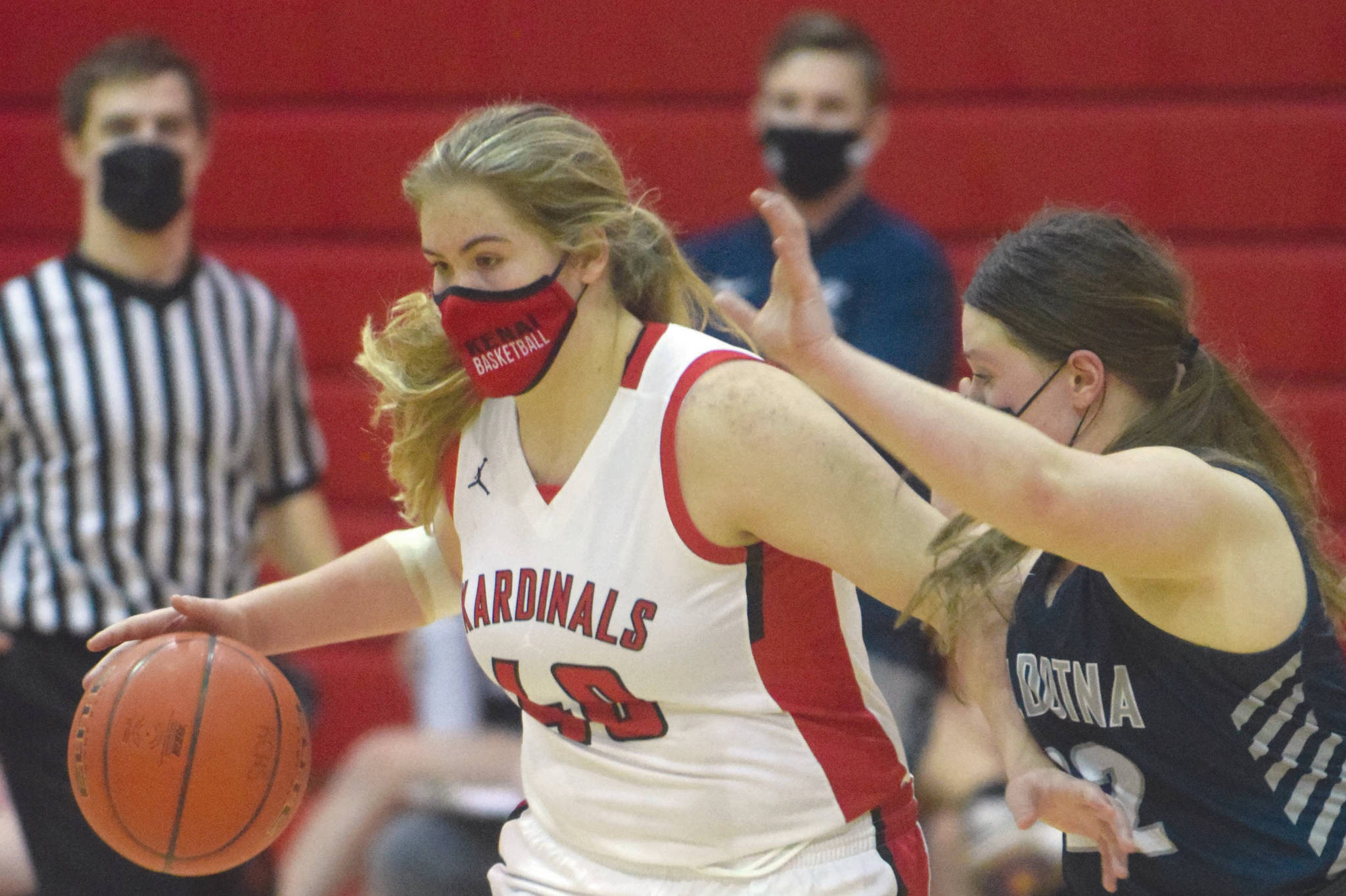 Kenai Central's Emma Back brings the ball up the floor against Soldotna's Autumn Fischer on Thursday, Feb. 11, 2021, at Kenai Central High School in Kenai, Alaska. (Photo by Jeff Helminiak/Peninsula Clarion)