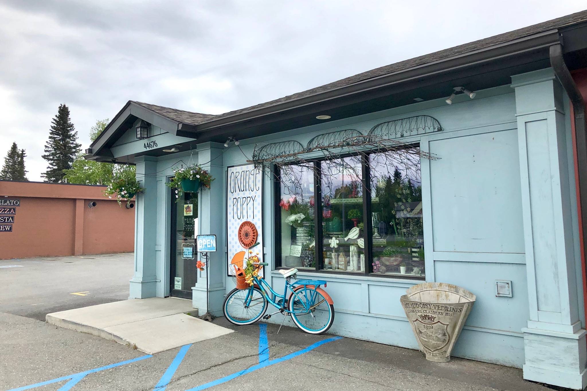 Orange Poppy, one of several businesses that have improved their storefront with the help of Soldotna’s Storefront Improvement Program, is photographed Wednesday, May 29, 2019, in Soldotna, Alaska. The improvement program awards grants to local businesses wanting to beautify their building’s exterior. (Photo by Victoria Petersen/Peninsula Clarion)