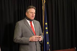 Gov. Mike Dunleavy speaks at an Anchorage news conference on Dec. 11, 2020. In a Sunday news conference, Dunleavy discussed the end of Alaska’s longtime COVID-19 disaster declaration and what it means for the state’s response to the virus. (Courtesy photo / Office of Gov. Mike Dunleavy)