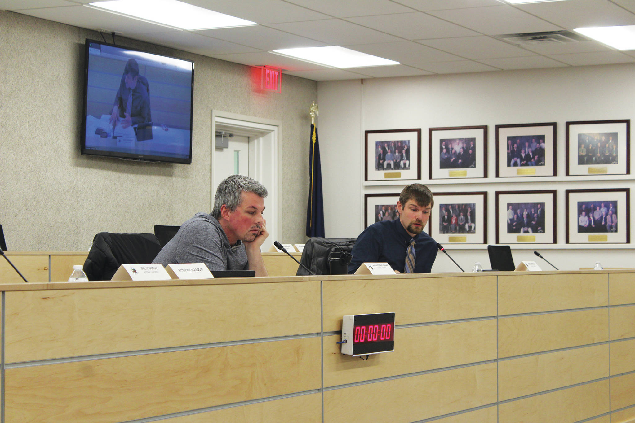 Kenai Peninsula Borough Assembly members Richard Derkevorkian (left) and Jesse Bjorkman (right) participate in the assembly’s Tuesday, Feb. 16, 2021 meeting at the borough assembly chambers in Soldotna, Alaska. The assembly voted Tuesday to fund 13 new positions for four fire and EMS service areas. (Photo by Ashlyn O’Hara/Peninsula Clarion)