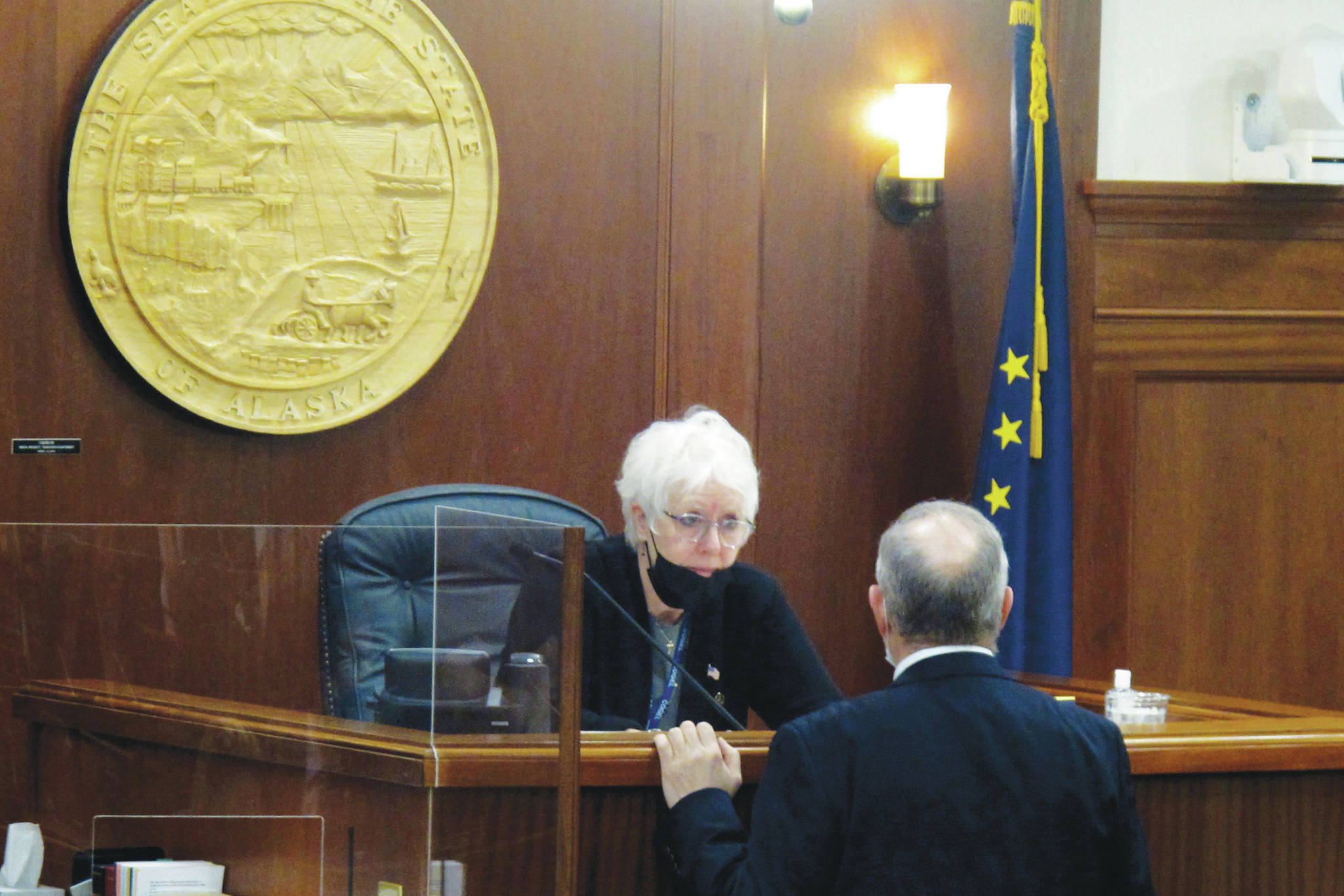 Becky Bohrer / Associated Press
Alaska House Speaker Louise Stutes speaks to Rep. Bryce Edgmon on the House floor on Thursday, in Juneau. The House, which has struggled to organize, on Thursday adopted a report setting out committee assignments, a month into the legislative session.