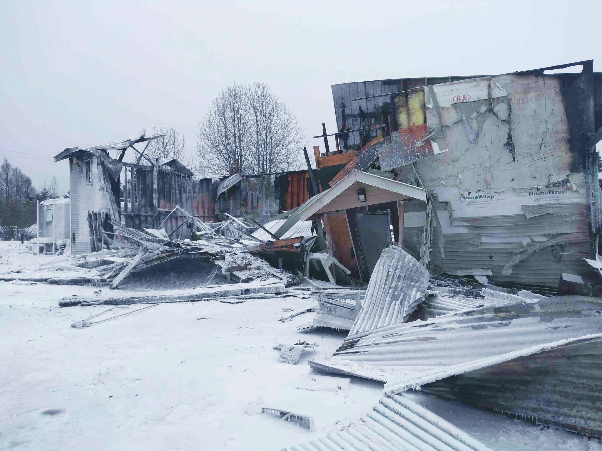 The collapsed remnants of the Trimvirate Theatre can be seen on Saturday, Feb. 20, 2021 in Nikiski, Alaska. The building burned down in an early morning fire on Saturday. (Photo courtesy of Joe Rizzo)