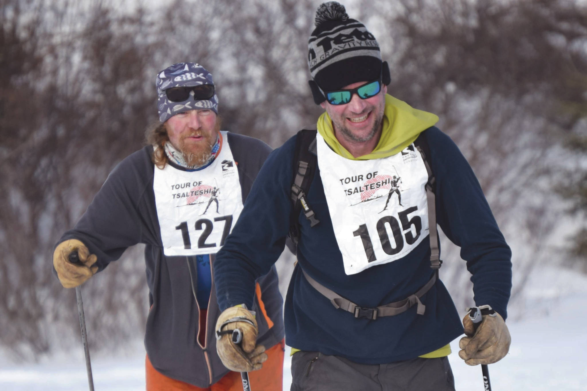 Sam Spencer, Erik Route and Josiah Brown, all of Cooper Landing, near the finish of the 20-kilometer classic race Sunday, Feb. 21, 2021, at Tsalteshi Trails just outside of Soldotna, Alaska. (Photo by Jeff Helminiak/Peninsula Clarion)