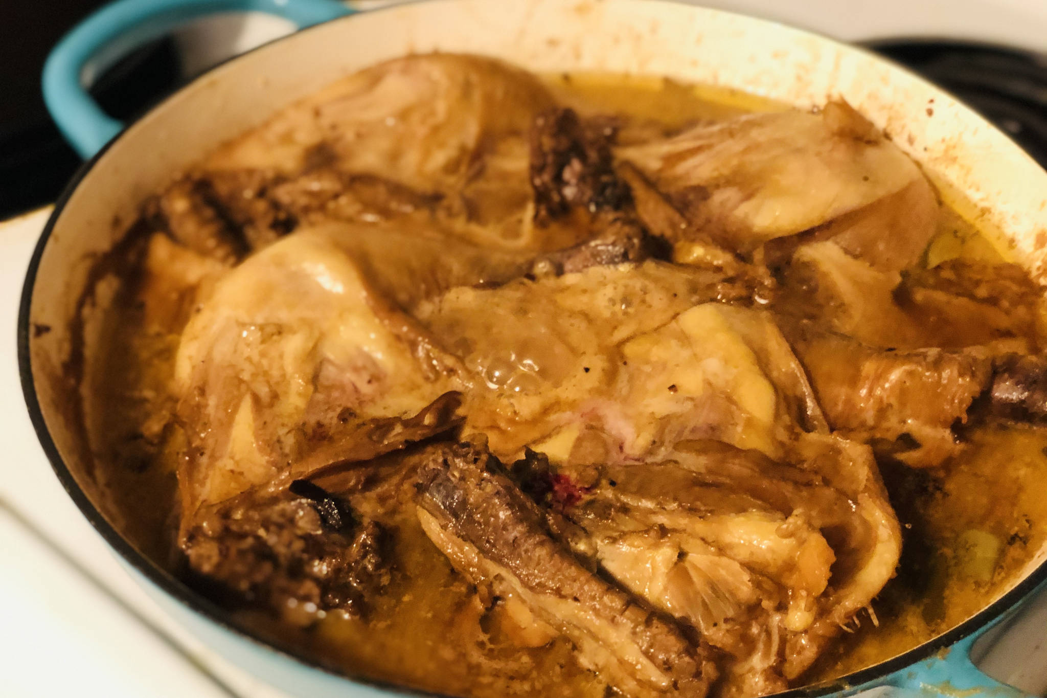 Chicken adobo simmering on the stove, on Monday, March 1, 2021, in Anchorage, Alaska. (Photo by Victoria Petersen/Peninsula Clarion)