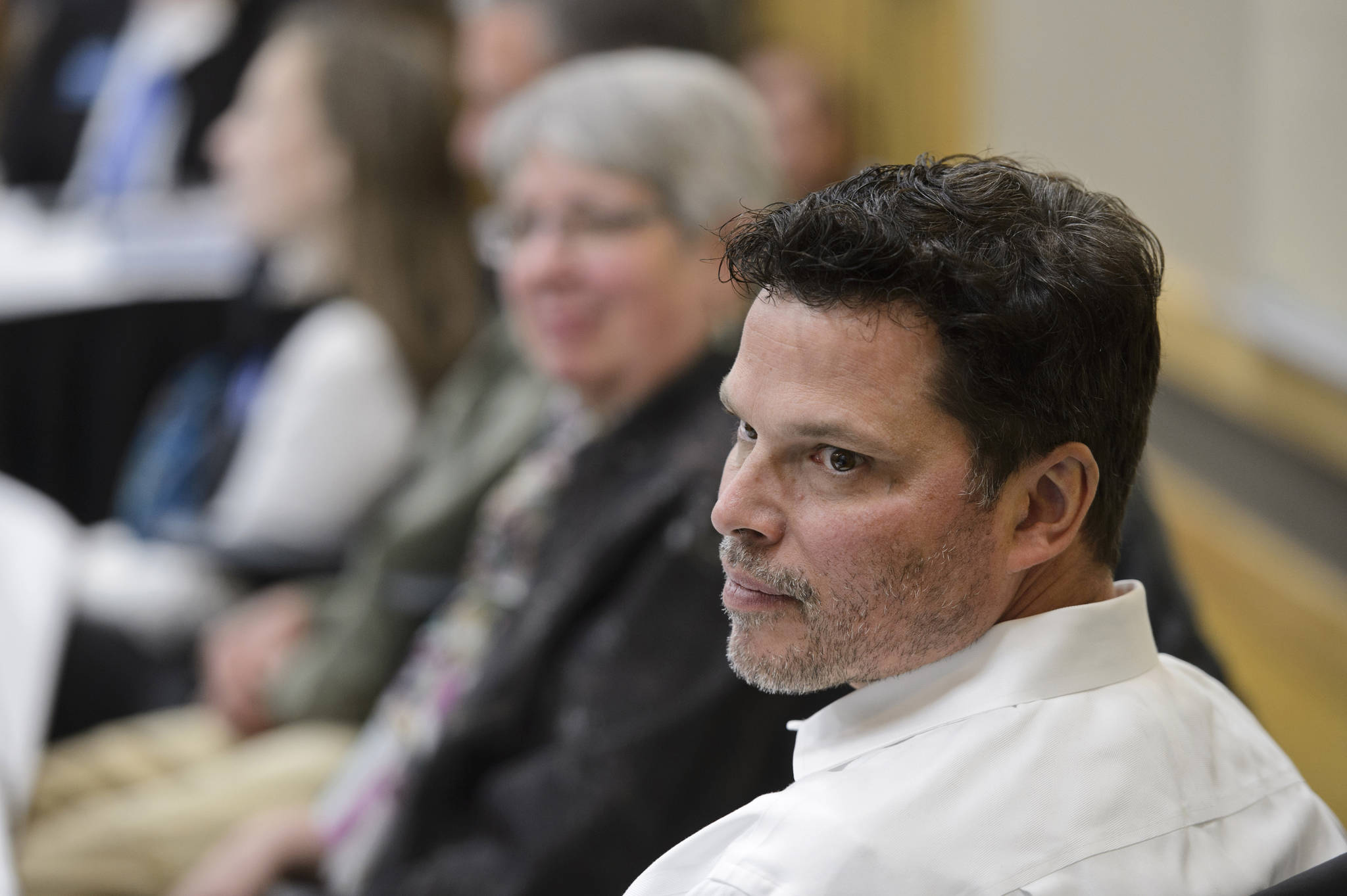 University of Alaska Board of Regents member Andy Teuber listens to a discussion during a meeting at UAA on Sept. 12, 2019, in Anchorage, Alaska. The U.S. Coast Guard is searching for an overdue helicopter piloted by Teuber who is the former head of the Alaska Native Tribal Health Consortium. Teuber had resigned last week after allegations of sexual misconduct surfaced against him which he denied. Teuber left Anchorage about 2 p.m. Tuesday, March 2, 2021, in a black and white Robinson R66 helicopter en route to Kodiak Island. (Marc Lester/Anchorage Daily News via AP)