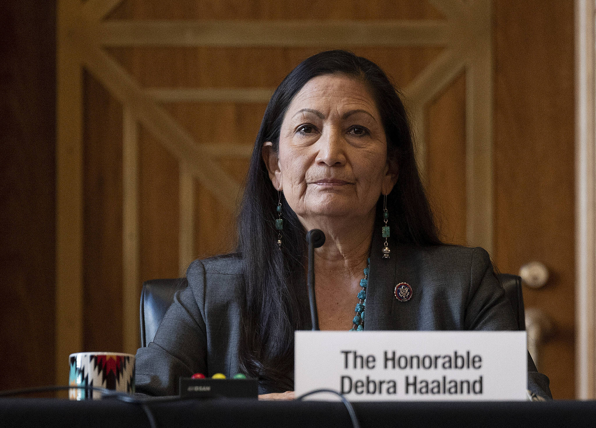 Jim Watson / Pool Photo
Rep. Deb Haaland, D-N.M., listens during the Senate Committee on Energy and Natural Resources hearing on her nomination to be Interior secretary, on Capitol Hill in Washington. Some Republican senators labeled Haaland “radical” over her calls to reduce dependence on fossil fuels and address climate change, and said that could hurt rural America and major oil and gas-producing states. The label of Haaland as a “radical” by Republican lawmakers is getting pushback from Native Americans.