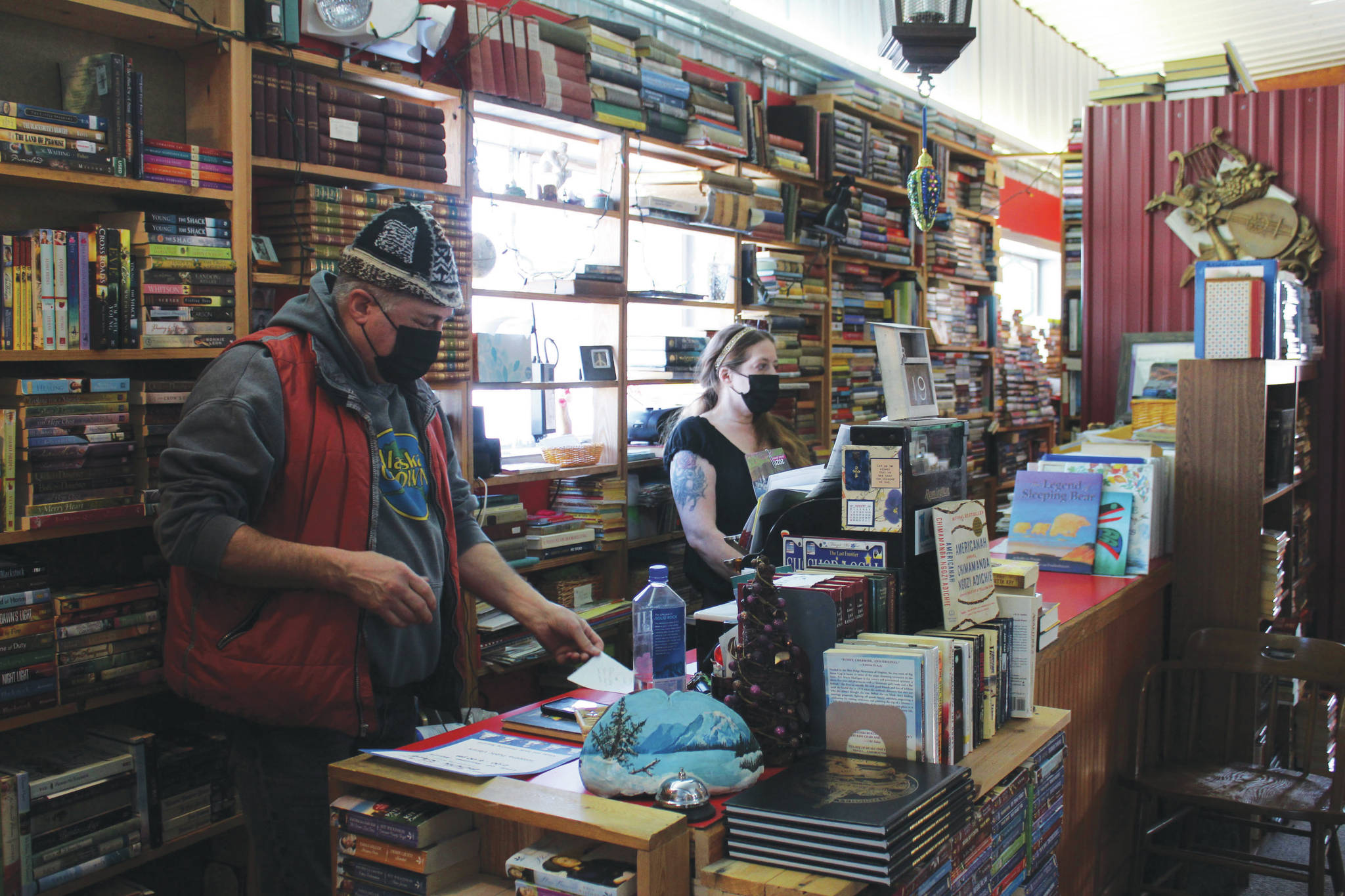 Benjamin Jackinsky (left) and Sarah O’Brien work at Already Read on Friday, Feb. 19 in Kenai, Alaska.