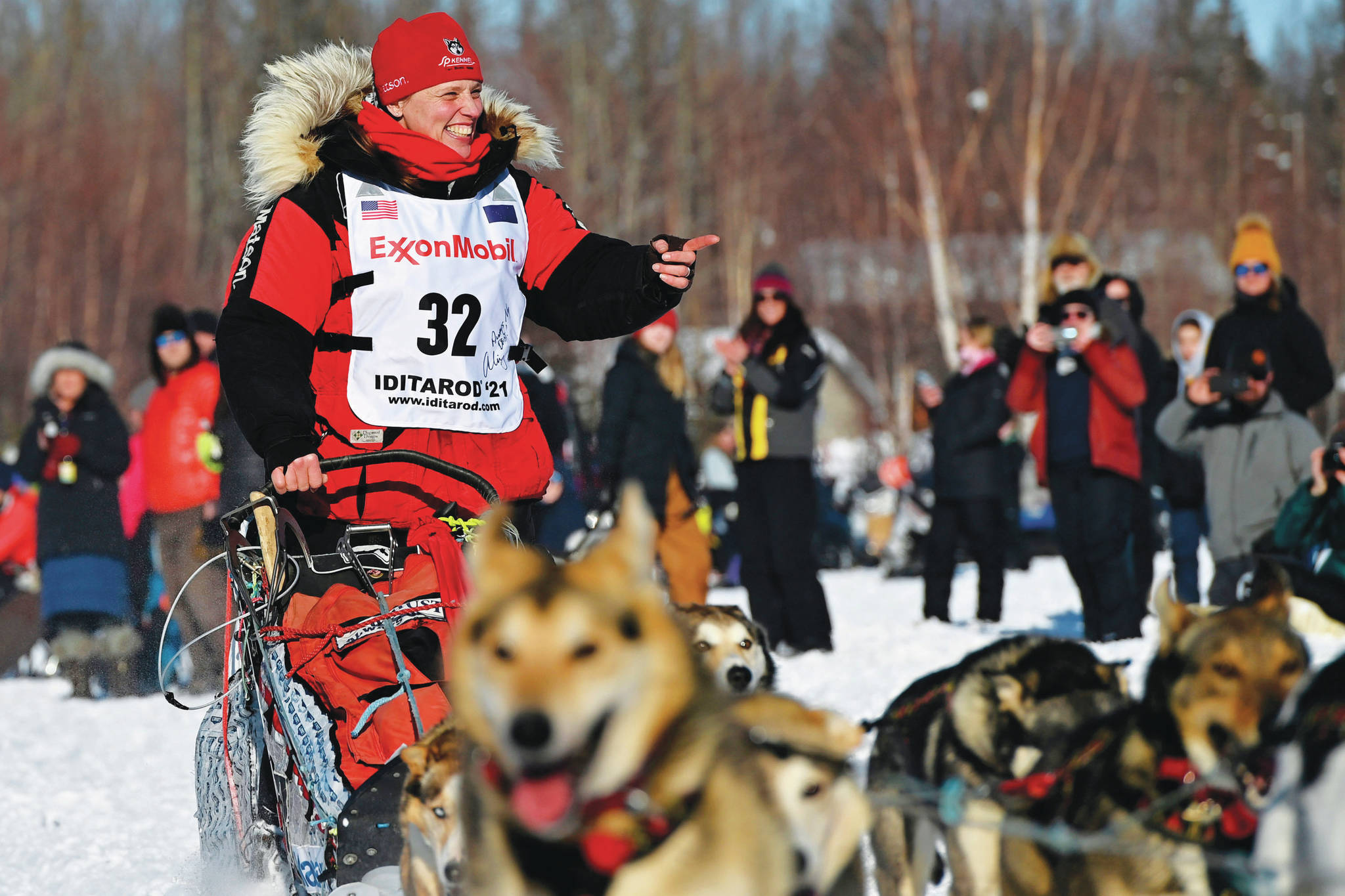 Marc Lester / Anchorage Daily News, via Associated Press
Aliy Zirkle, of Two Rivers, greets fans as she passes by at the Iditarod Sled Dog Race start at Deshka Landing in Willow on Sunday. 
Aliy Zirkle, of Two Rivers, greets fans as she passes by at the Iditarod Sled Dog Race start at Deshka Landing in Willow, Alaska, Sunday, March 7, 2021. (Marc Lester/Anchorage Daily News via AP, Pool)