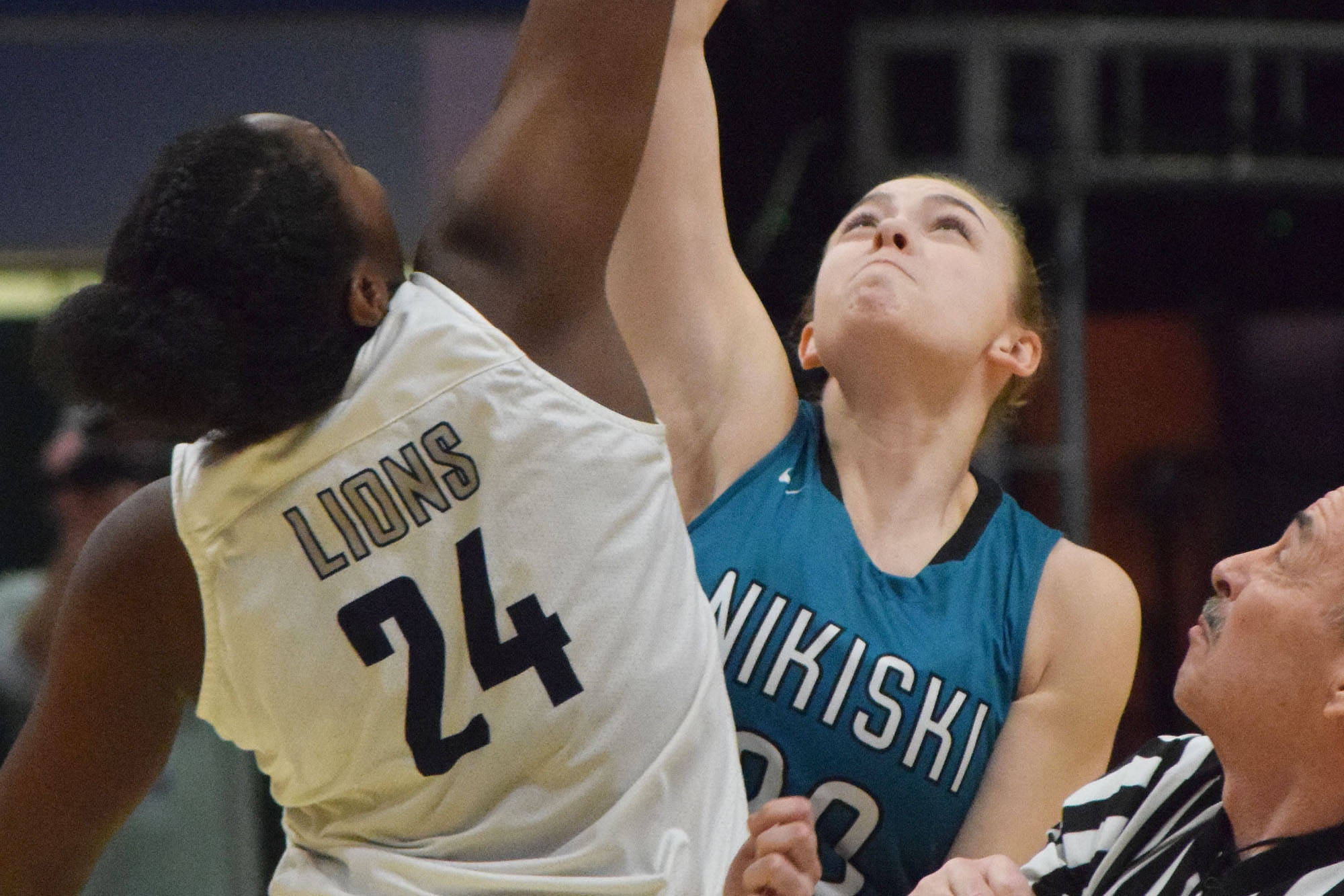Nikiski’s Bethany Carstens (right) and ACS’s Jordan Todd tip off to begin the 2019 Class 3A girls state basketball championship at the Alaska Airlines Center in Anchorage. (Photo by Joey Klecka/Peninsula Clarion)