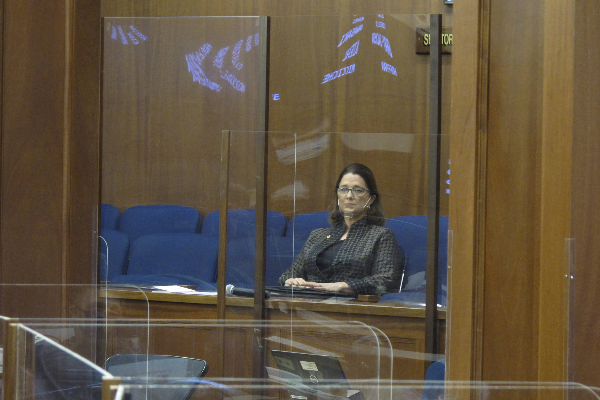 Alaska state Sen. Lora Reinbold sits in a Senate gallery on Friday, March 12, 2021, in Juneau, Alaska. The Alaska Senate voted Wednesday to allow leadership to restrict access to the Capitol by Reinbold, an Eagle River Republican, over violations of protocols meant to guard against COVID-19. (AP Photo/Becky Bohrer, Pool)