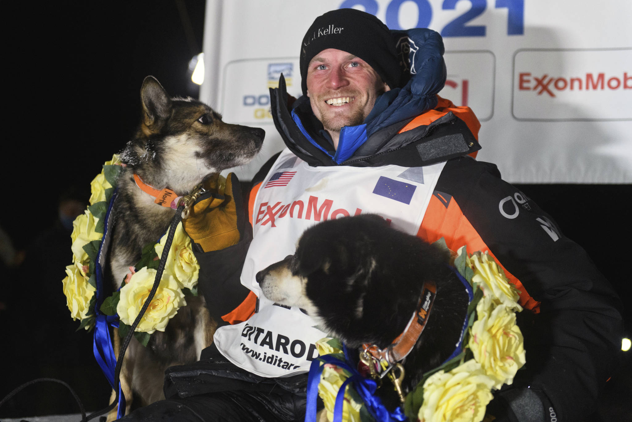Dallas Seavey poses with his dogs after winning the Iditarod Trail Sled Dog Race race near Willow, Alaska, early Monday, March 15, 2021. (Marc Lester/Anchorage Daily News via AP, Pool)