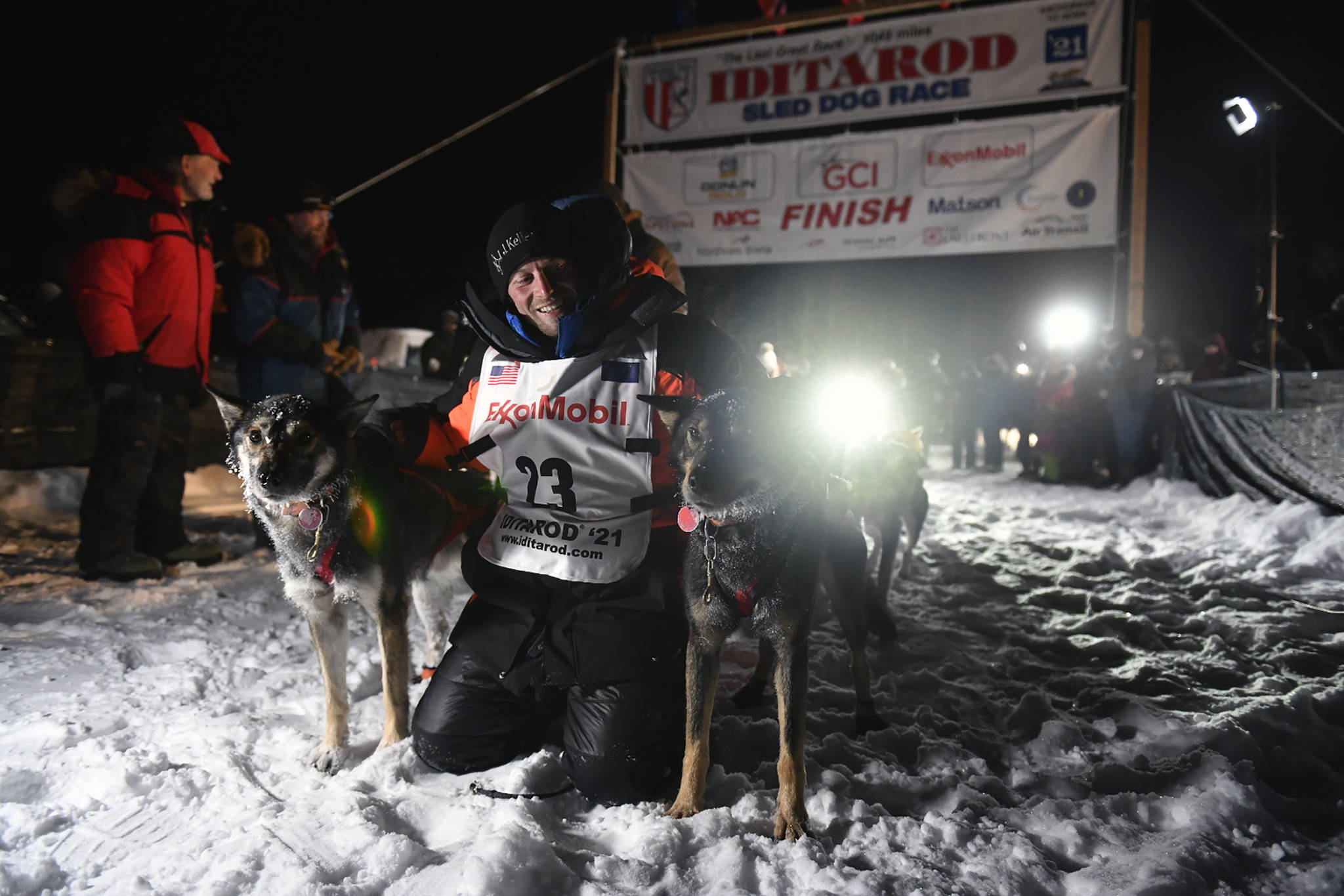 Dallas Seavey poses with his dogs after crossing the finish line to win the Iditarod Trail Sled Dog Race race near Willow, Alaska, early Monday, March 15, 2021. (Marc Lester/Anchorage Daily News via AP, Pool)