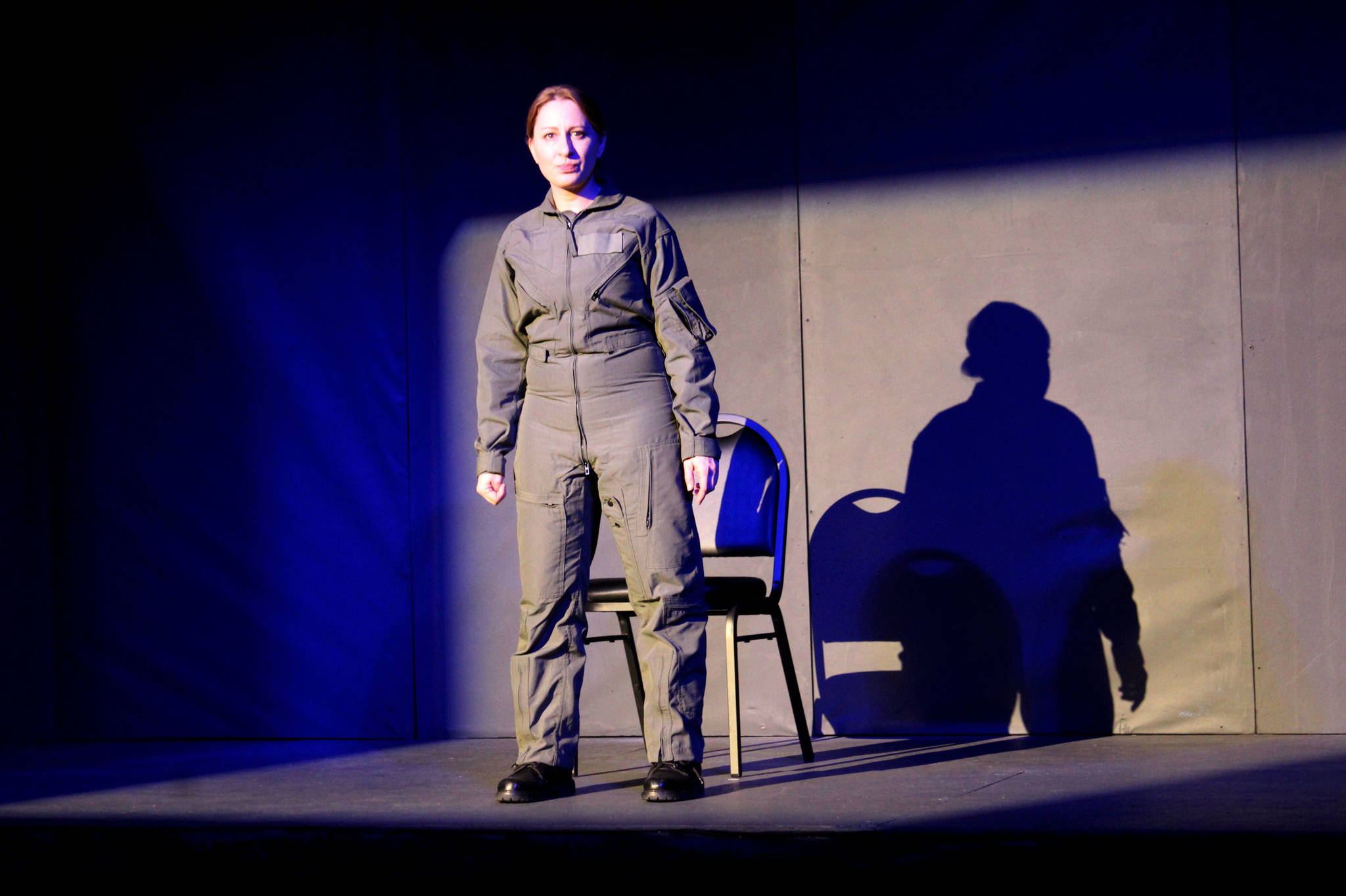 AnnMarie Rudstrom portrays The Pilot during a rehearsal of "Grounded" at the Kenai Performers' black box theater on Monday, March 15 in Soldotna, Alaska. (Ashlyn O'Hara/Peninsula Clarion)