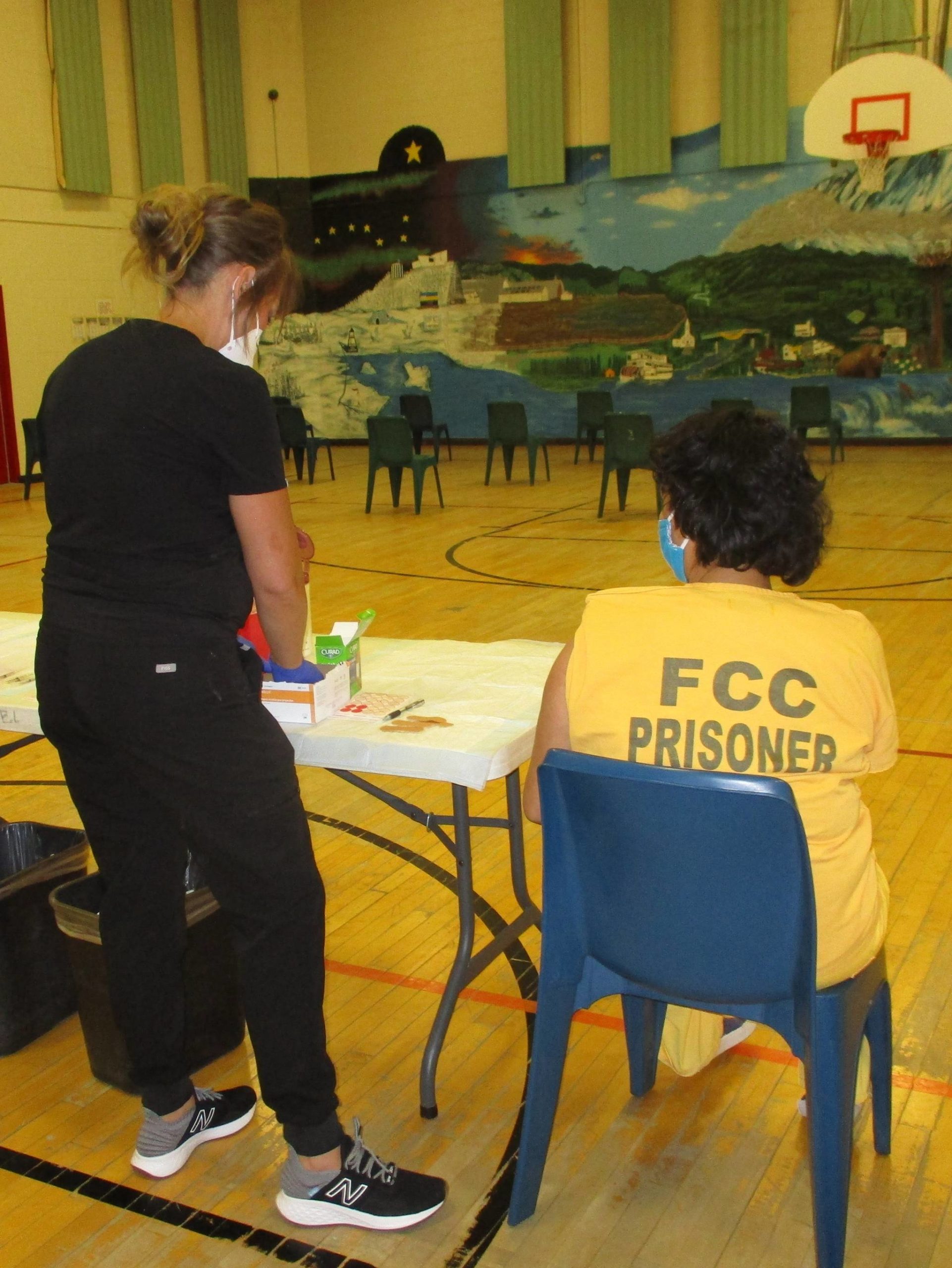 Courtesy photo / DOC
A Department of Corrections nurse vaccinates a Fairbanks Correctional Center inmate. The DOC eased restrictions on March 15, 2021, to allow attorneys to visit fully vaccinated inmates at DOC facilities.