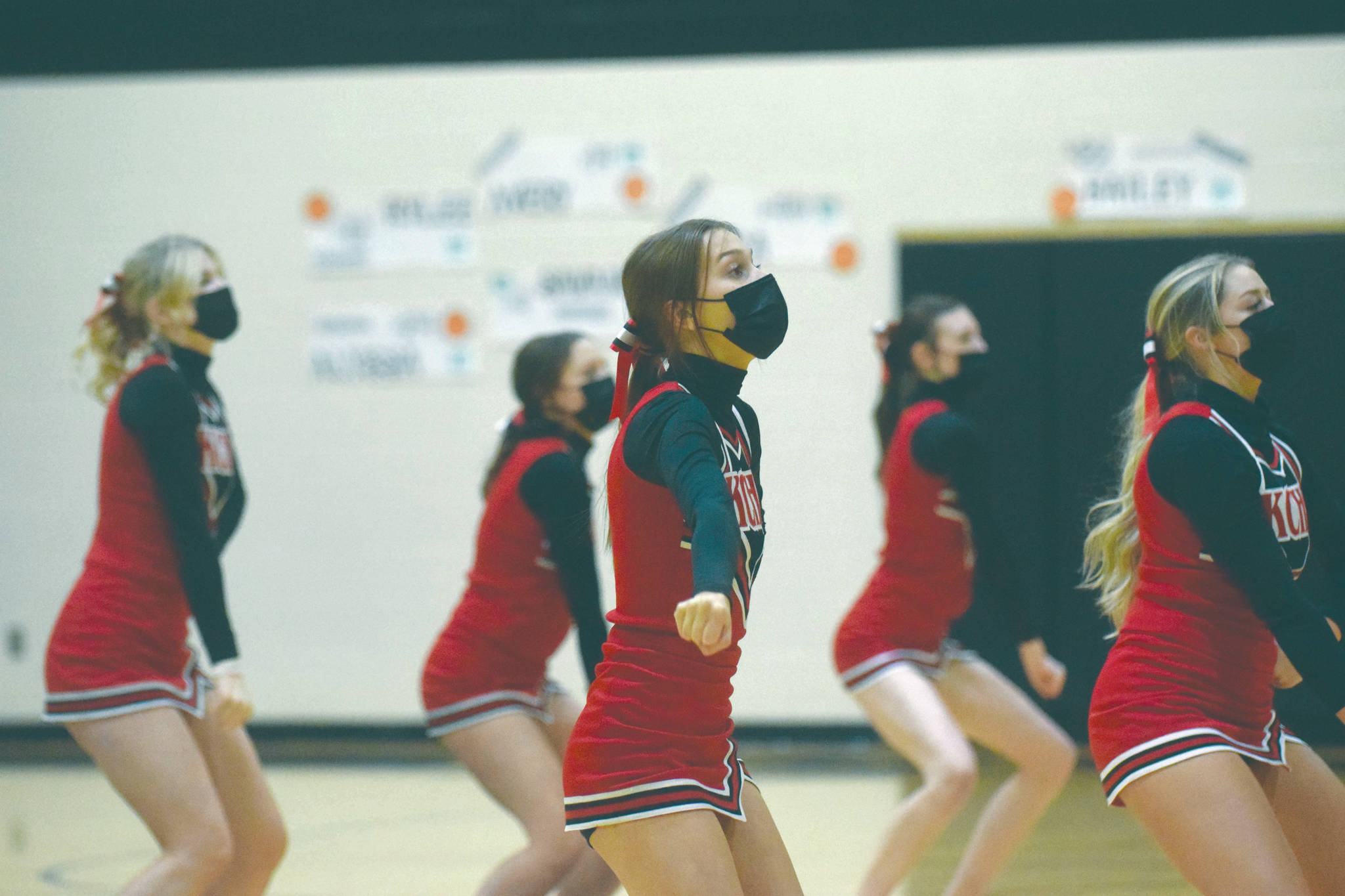 The Kenai Central High School cheerleading team cheers at the Southcentral Conference tournament Friday, March 16, 2021, at Nikiski High School in Nikiski, Alaska. (Photo by Jeff Helminiak/Peninsula Clarion)