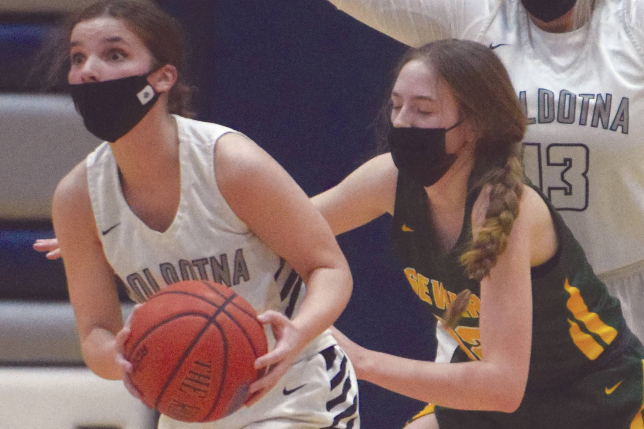 Soldotna’s Morgan Bouschor looks for an outlet pass under pressure from Seward’s Shelby Sieminski as Soldotna’s Taylor Edwards looks on at Soldotna High School on Tuesday, Feb. 23, 2021, in Soldotna, Alaska. (Photo by Jeff Helminiak/Peninsula Clarion)