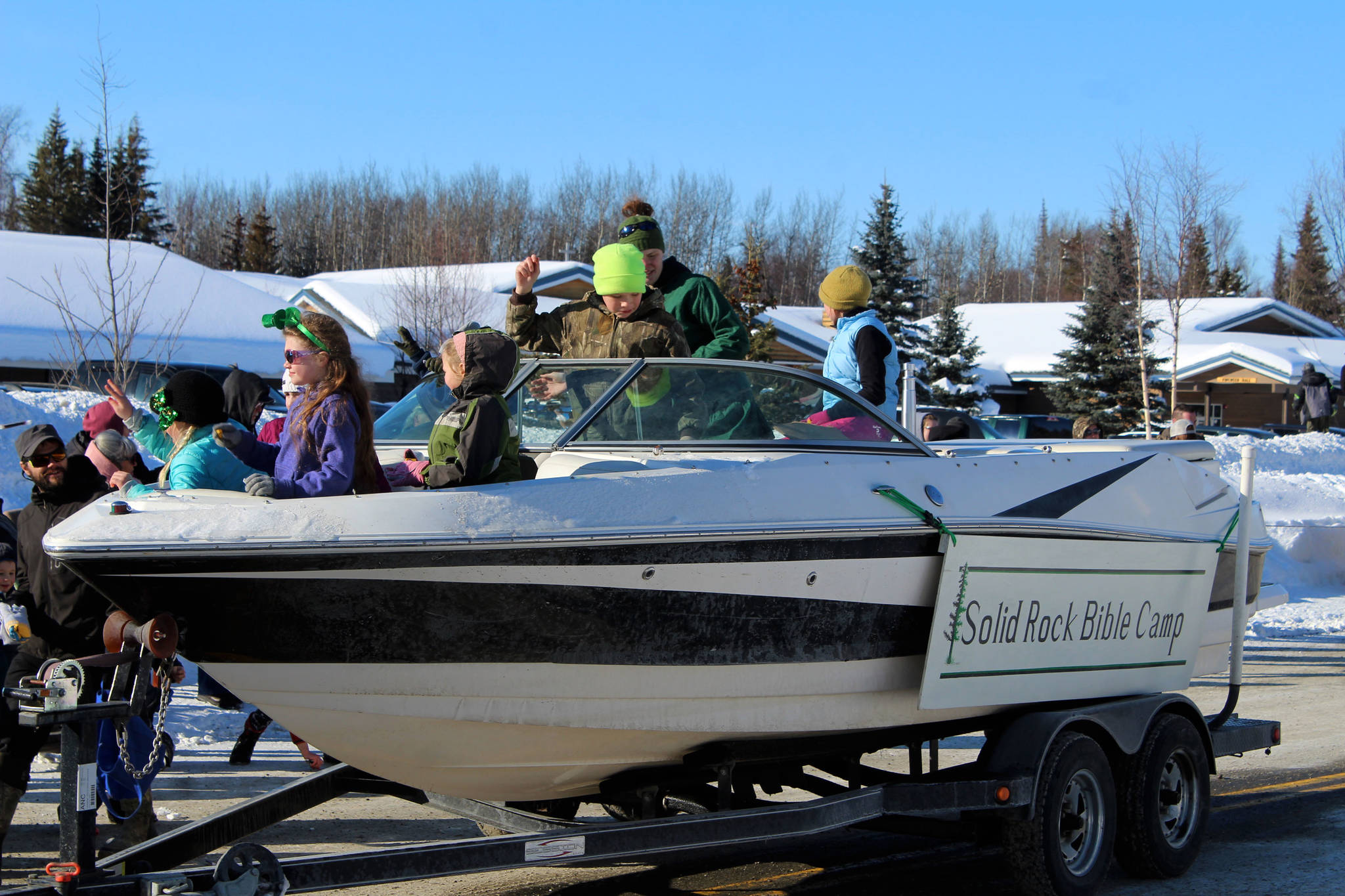Participants with Solid Rock Bible Camp throw candy to parade-watchers during the 30th Annual Sweeney’s St. Patrick’s Day parade on Wednesday, March 17 in Soldotna, Alaska. (Ashlyn O’Hara/Peninsula Clarion)