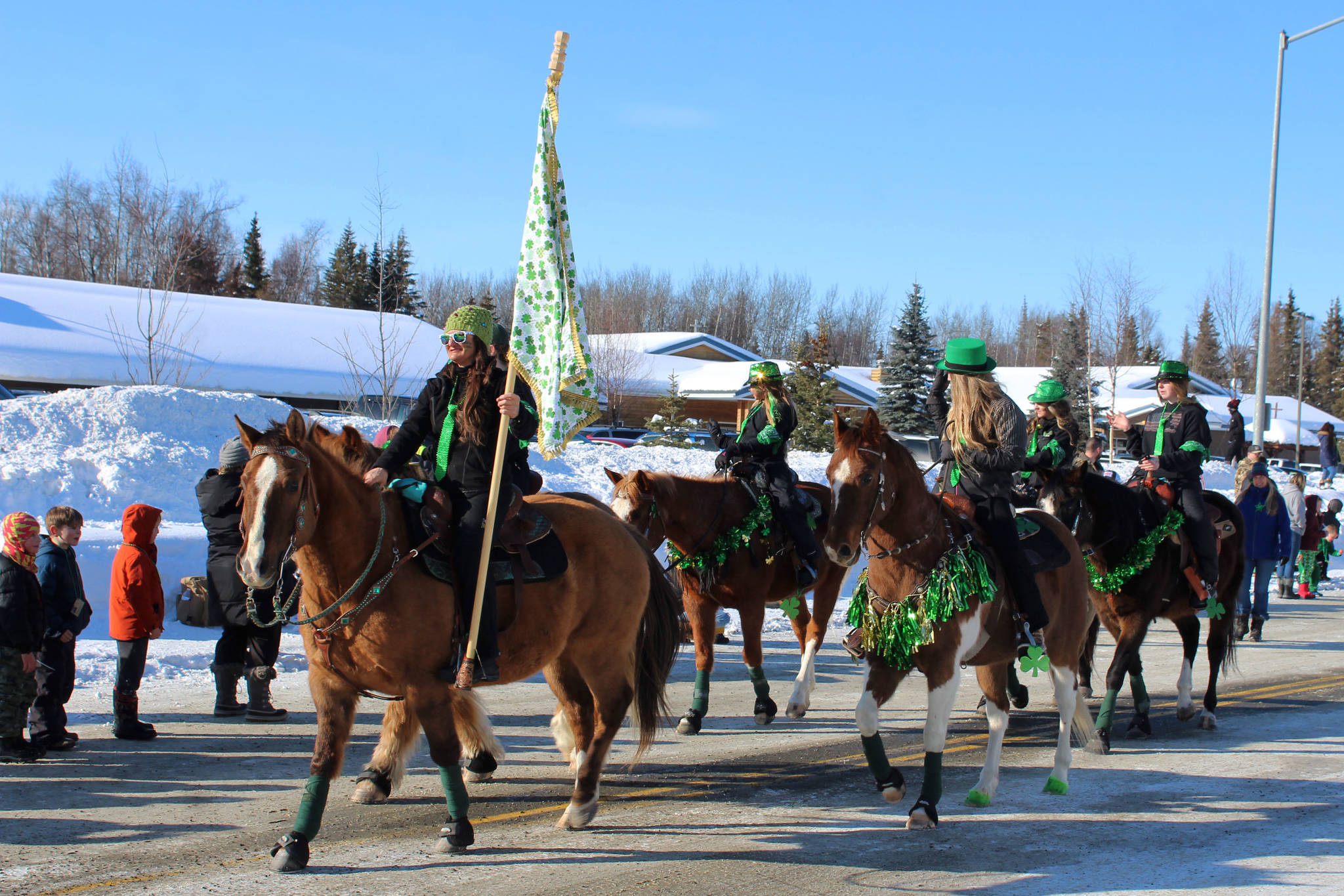 Riders with Alaska C&C Horse Adventures participate in the 30th Annual Sweeney’s St. Patrick’s Day Parade on Wednesday, March 17 in Soldotna, Alaska. (Ashlyn O’Hara/Peninsula Clarion)