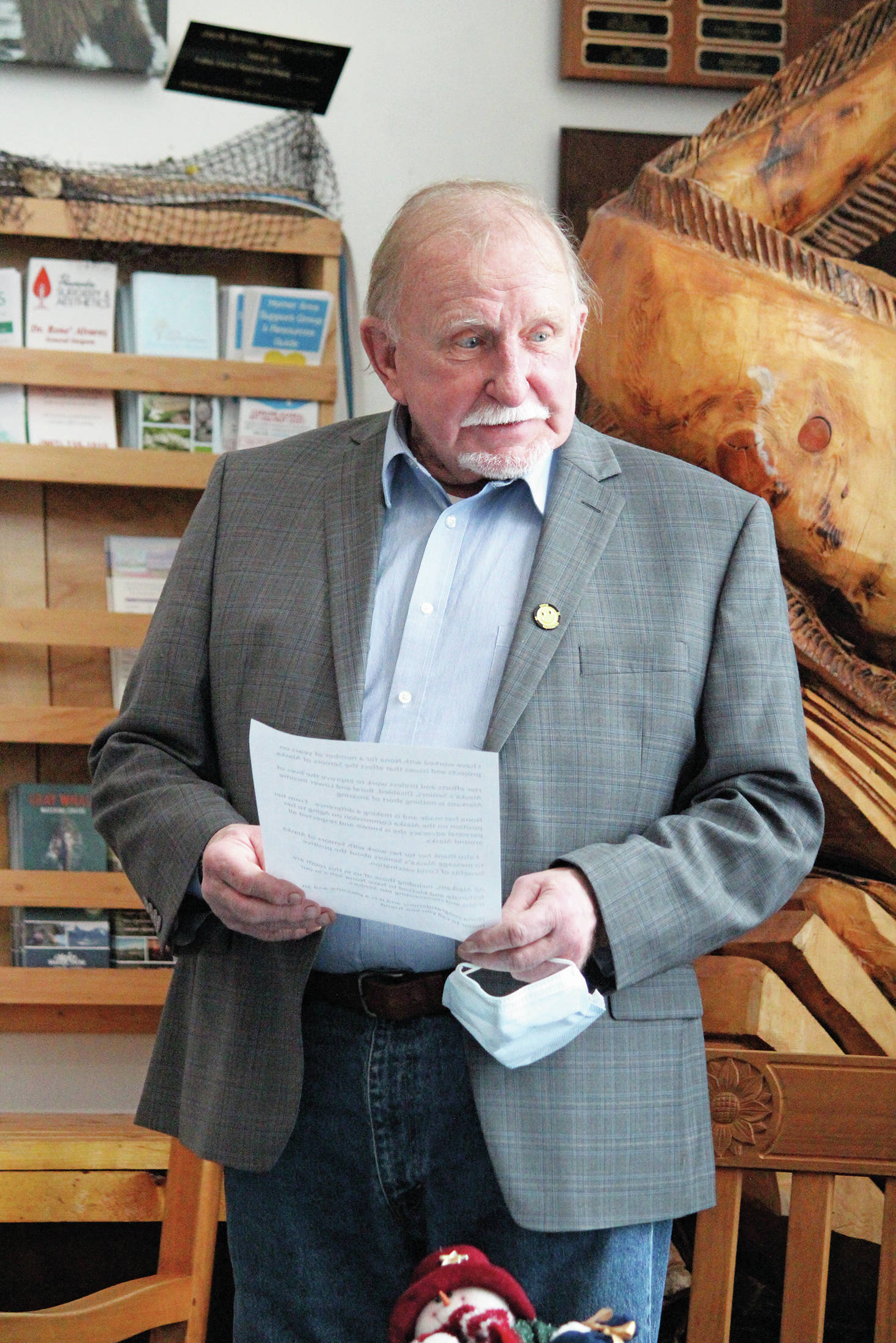 Peter Zuyus, executive director of the nonprofit Seniors of Alaska, speaks at a recognition and award ceremony for local senior advocate Nona Safra on Wednesday, March 10, 2021 at the Homer Chamber of Commerce & Visitor Center in Homer, Alaska. (Photo by Megan Pacer/Homer News)
