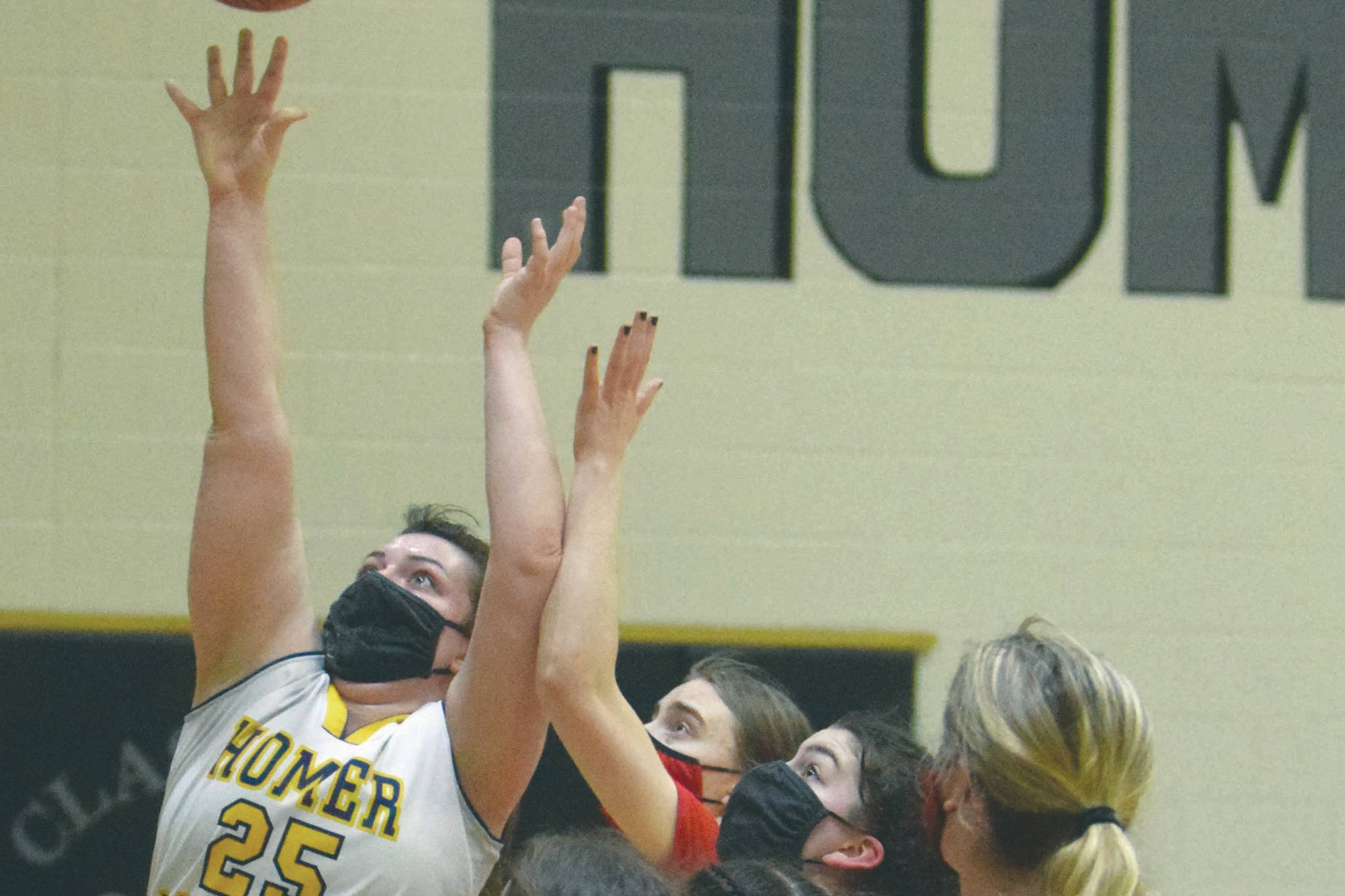 Homer's Tonda Smude scores against Kenai Central on Friday, March 12, 2021, at the Southcentral Conference tournament at Nikiski High School in Nikiski, Alaska. (Photo by Jeff Helminiak/Peninsula Clarion)