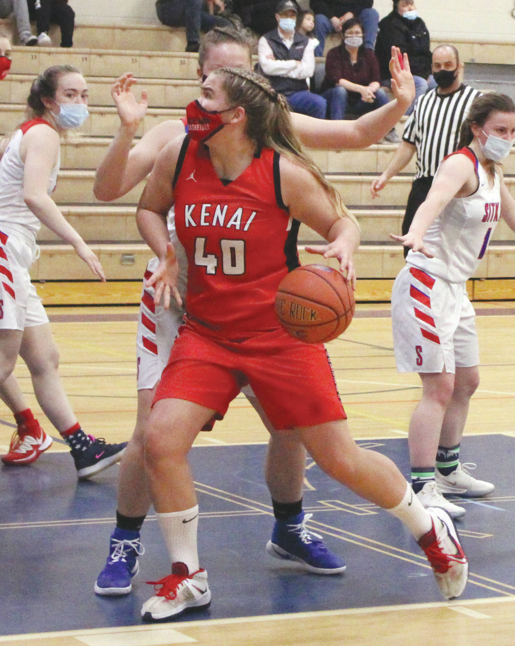 Kenai Central’s Emma Beck drives to the basket against Sitka on Thursday, March 25, 2021, at the Class 3A state girls tournament at Palmer Middle School in Palmer, Alaska. (Photo by Tim Rockey/Frontiersman)