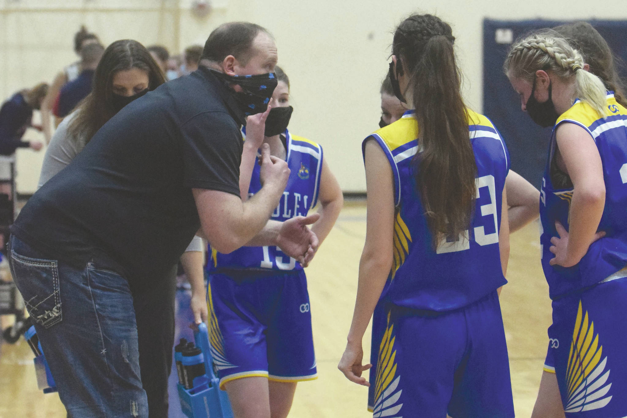 Cook Inlet Academy girls head coach Josh Hawley coaches at the Peninsula Conference tournament Friday, March 19, 2021, at Soldotna High School in Soldotna, Alaska. (Photo by Jeff Helminiak/Peninsula Clarion)