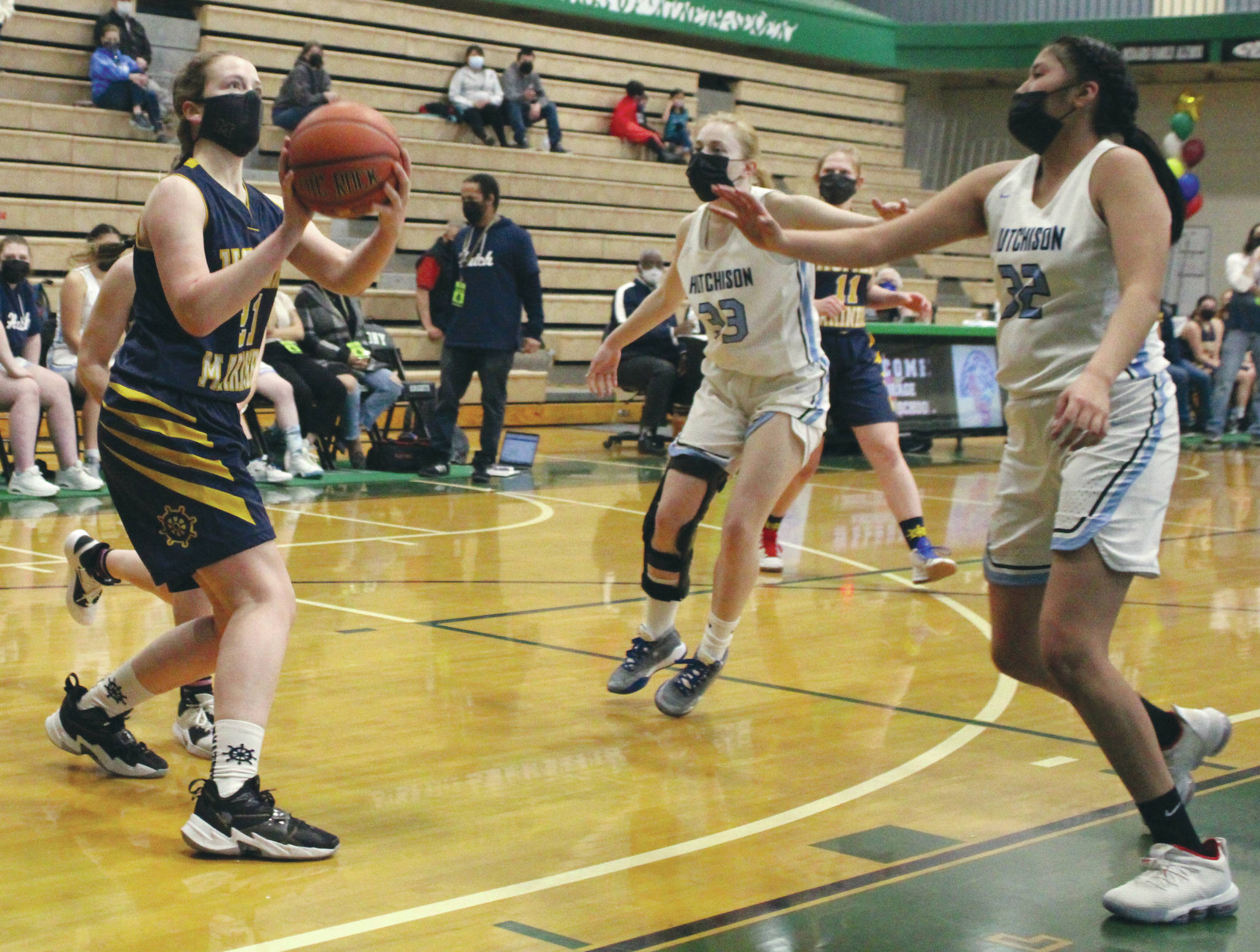 Homer’s Sophie Ellison triggers a shot against Hutchison on Friday, March 26, 2021, at the Class 3A state basketball tournament at Colony High School in Alaska. (Photo by Tim Rockey/Frontiersman)