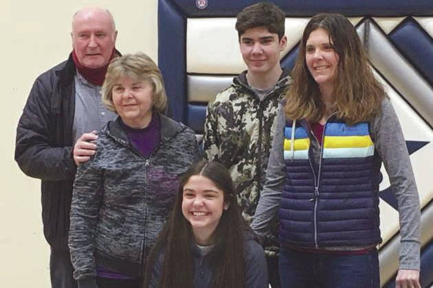 Erika Arthur signs her National Letter of Intent on Tuesday, March 30, 2021, at Soldotna High School in Soldotna, Alaska. Behind her are grandparents, Mike and Gloria Sweeney; brother, Andrew Arthur; and mother, Krista Arthur. (Photo provided)