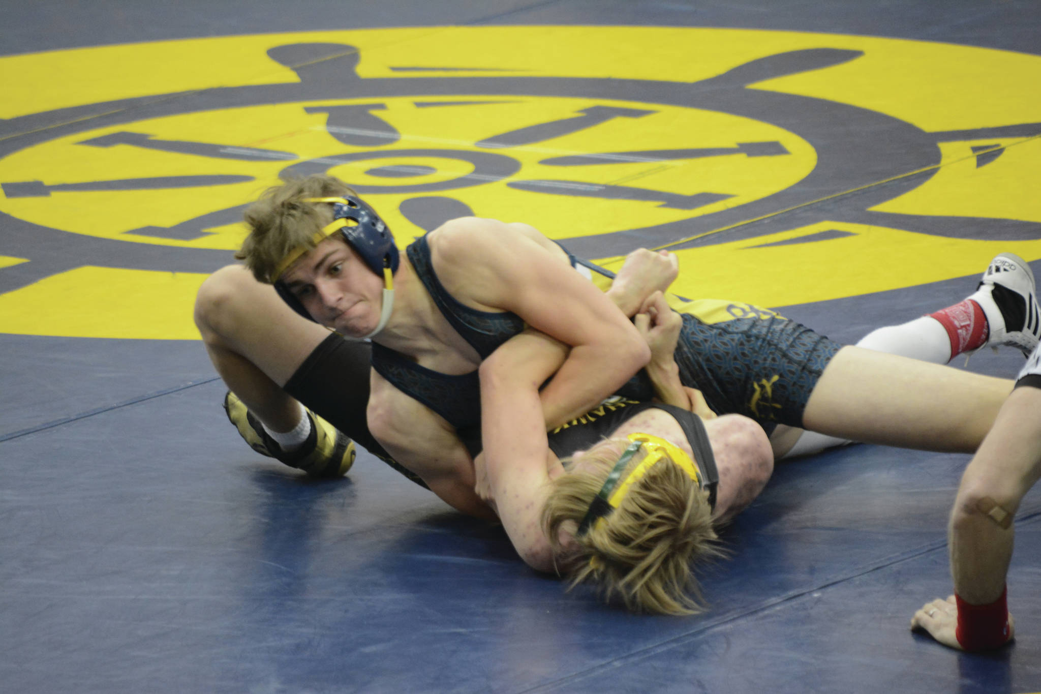 Homer High School Mariner Austin Cline, top, attempts to pin Seward Seahawk Jacob Wendt at a wrestling meet on Friday, April 2,in the Alice Witte Gymnasium at Homer High School in Homer. (Photo by Michael Armstrong/Homer News)