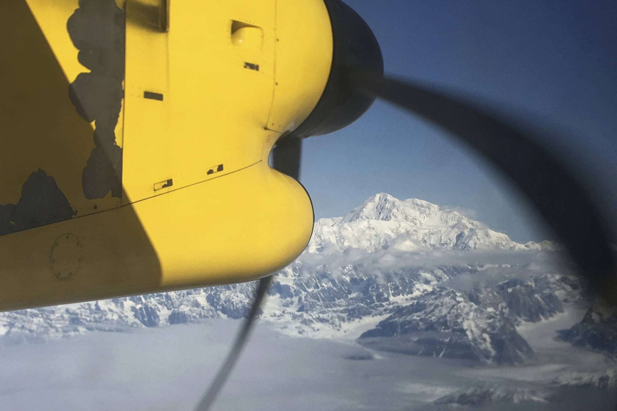 This May 10, 2017 file photo shows Denali, North America’s tallest peak, from an airplane flying over the Alaska Range near Talkeetna, Alaska. Officials on Monday, April 5, 2021, said five people had to ski to a shelter after they landed on Ruth Glacier at the base of Denali on April 2, 2021, and a heavy snowstorm stranded them for at least three days. (AP Photo/Mark Thiessen, File)