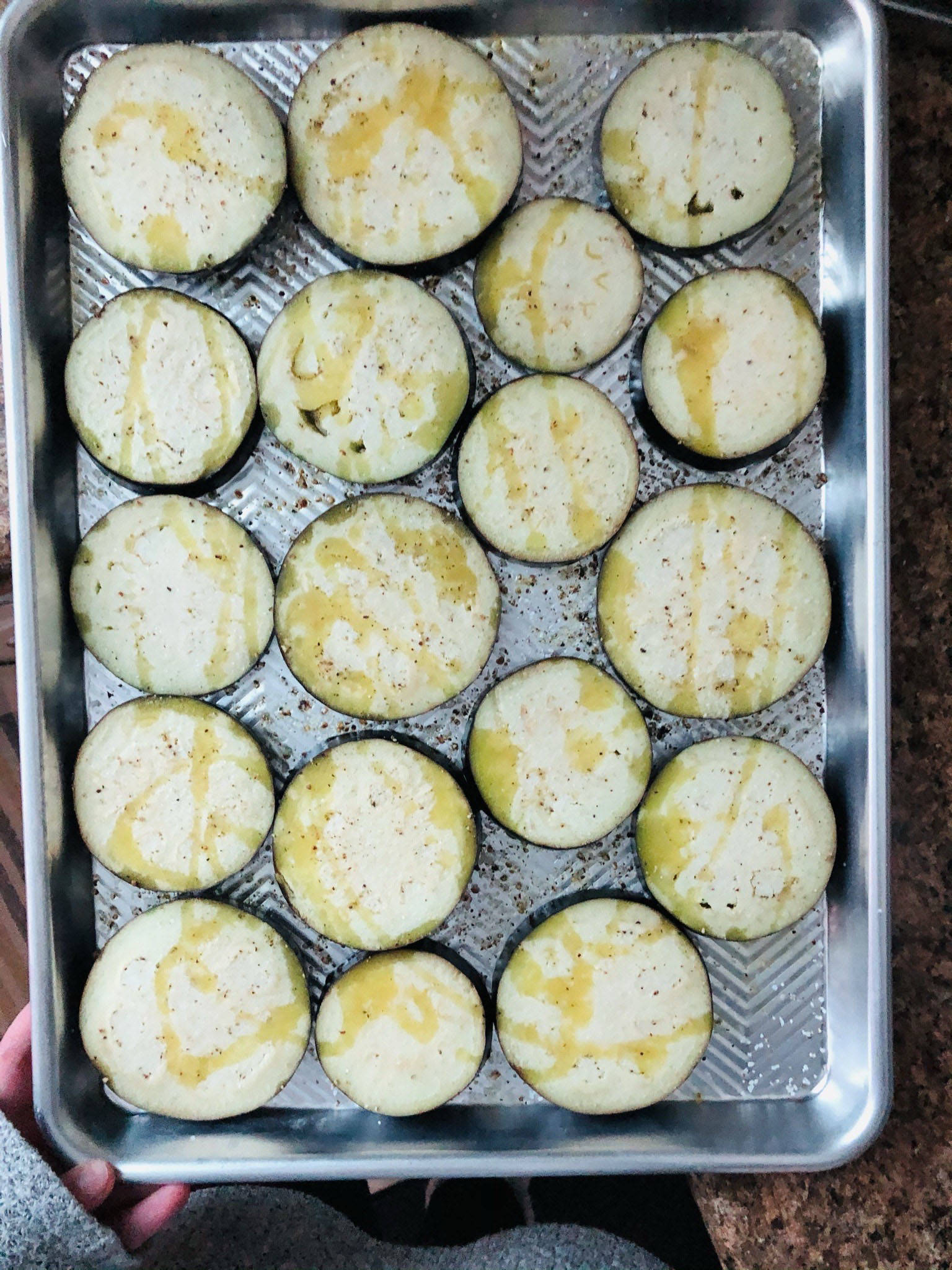 Roasting eggplant slices for a versatile meal, photographed on March 10, 2021, in Anchorage, Alaska. (Photo by Victoria Petersen/Peninsula Clarion)