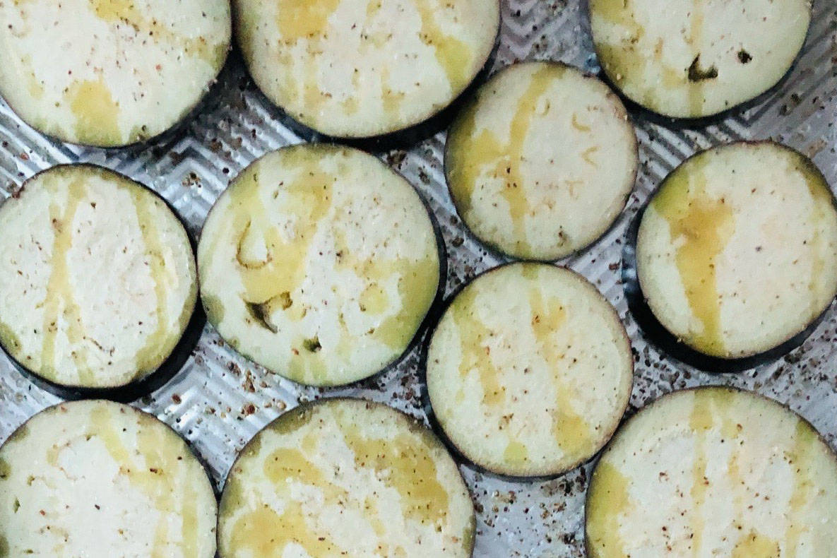 Roasting eggplant slices for a versatile meal, photographed on March 10, 2021, in Anchorage, Alaska. (Photo by Victoria Petersen/Peninsula Clarion)