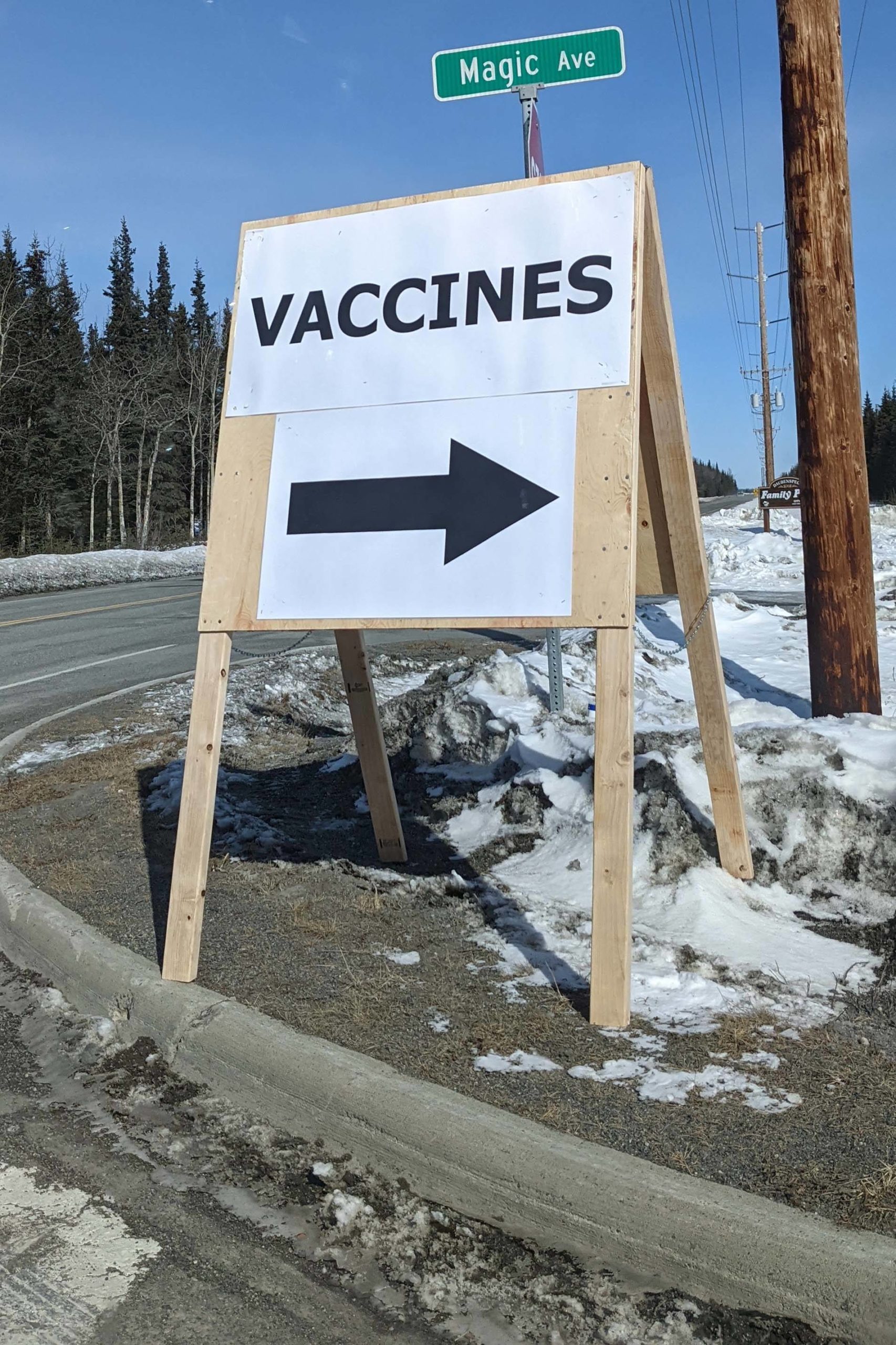 A sign is posted directing drivers to a vaccine clinic held at Beacon Occupational Health in Kenai, Alaska, on Saturday, April 10, 2021. (Photo by Erin Thompson/Peninsula Clarion)