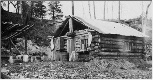 Photo from the Knackstedt Collection 
This shelter cabin, located near the confluence of the Moose and Kenai rivers, was constructed in the early 1920s for mail carriers traveling by dog sled between Seward and Kenai.