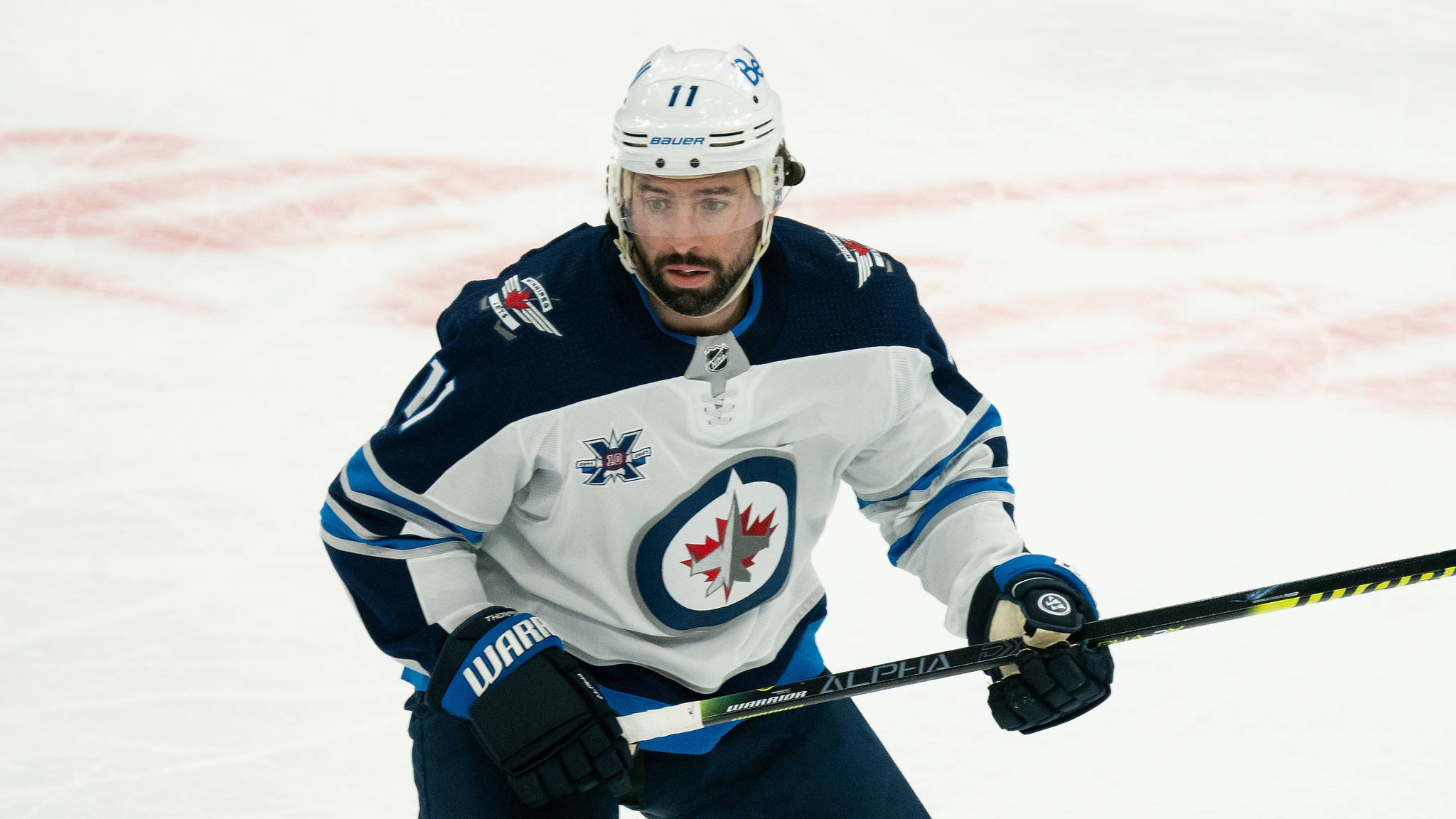 Winnipeg Jets center Nate Thompson (11) during an NHL hockey game against the Toronto Maple Leafs on Thursday, April 15, 2021, in Toronto, Canada. (AP Photo/Peter Power)