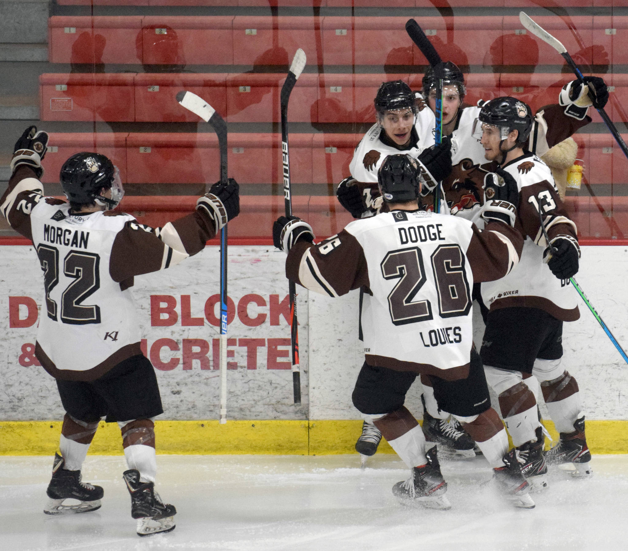 Max Helgeson of the Kenai River Brown Bears celebrates his third-period goal with Peter Morgan, Lucas Wahlin, Daymin Dodge and Adam Szubert on Friday, April 23, 2021, at the Soldotna Regional Sports Complex in Soldotna, Alaska. (Photo by Jeff Helminiak/Peninsula Clarion)
