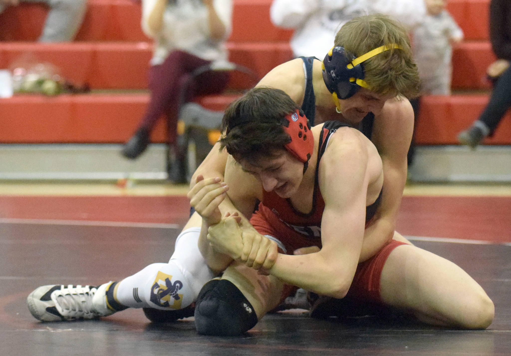 Homer’s Austin Cline wrestles to a 20-13 decision over Kenai Central’s Talon Whicker at 135 pounds Tuesday, April 27, 2021, at Kenai Central High School in Kenai, Alaska. (Photo by Jeff Helminiak/Peninsula Clarion)